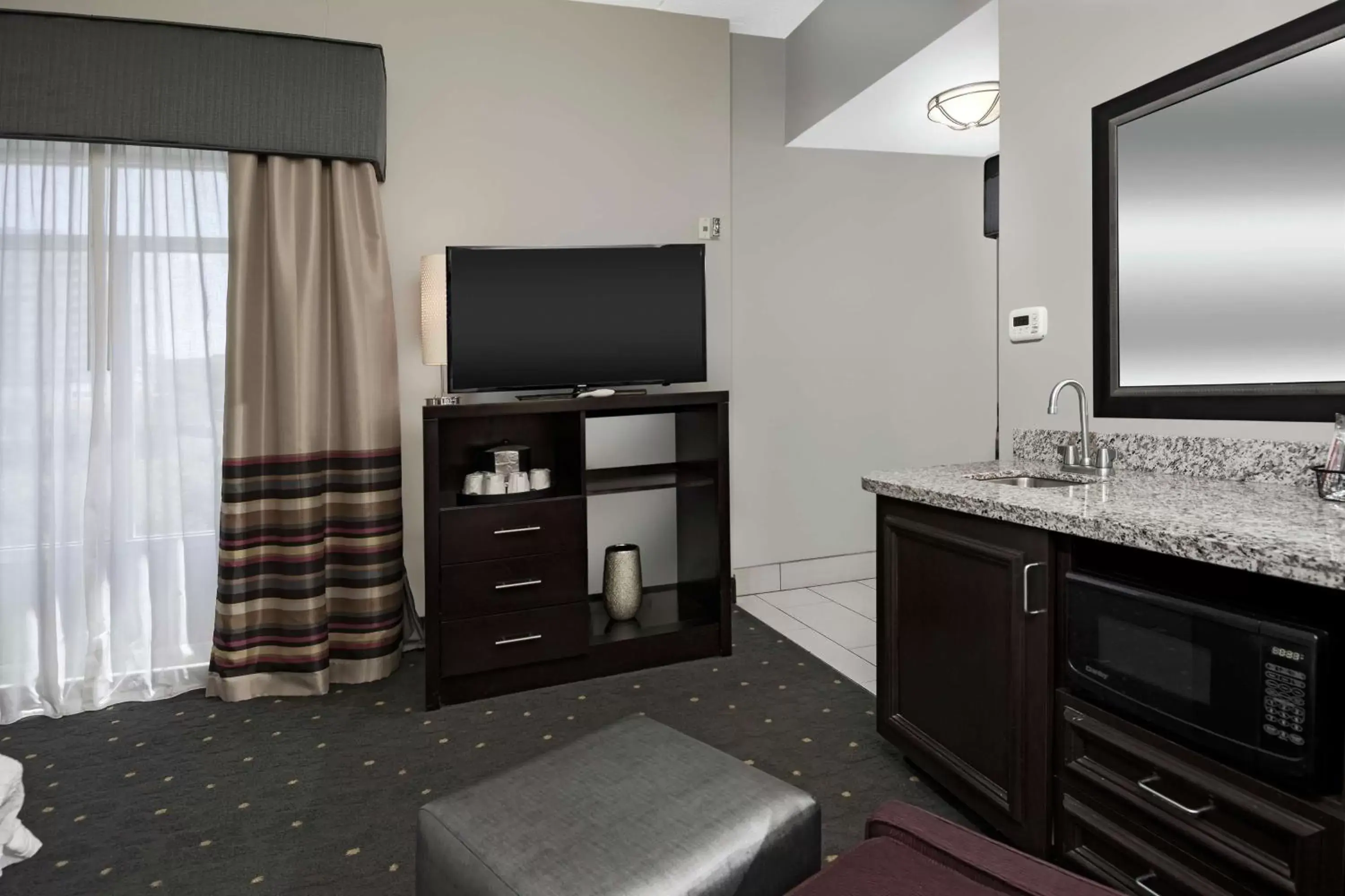 Photo of the whole room, TV/Entertainment Center in Hampton Inn & Suites - Raleigh Downtown