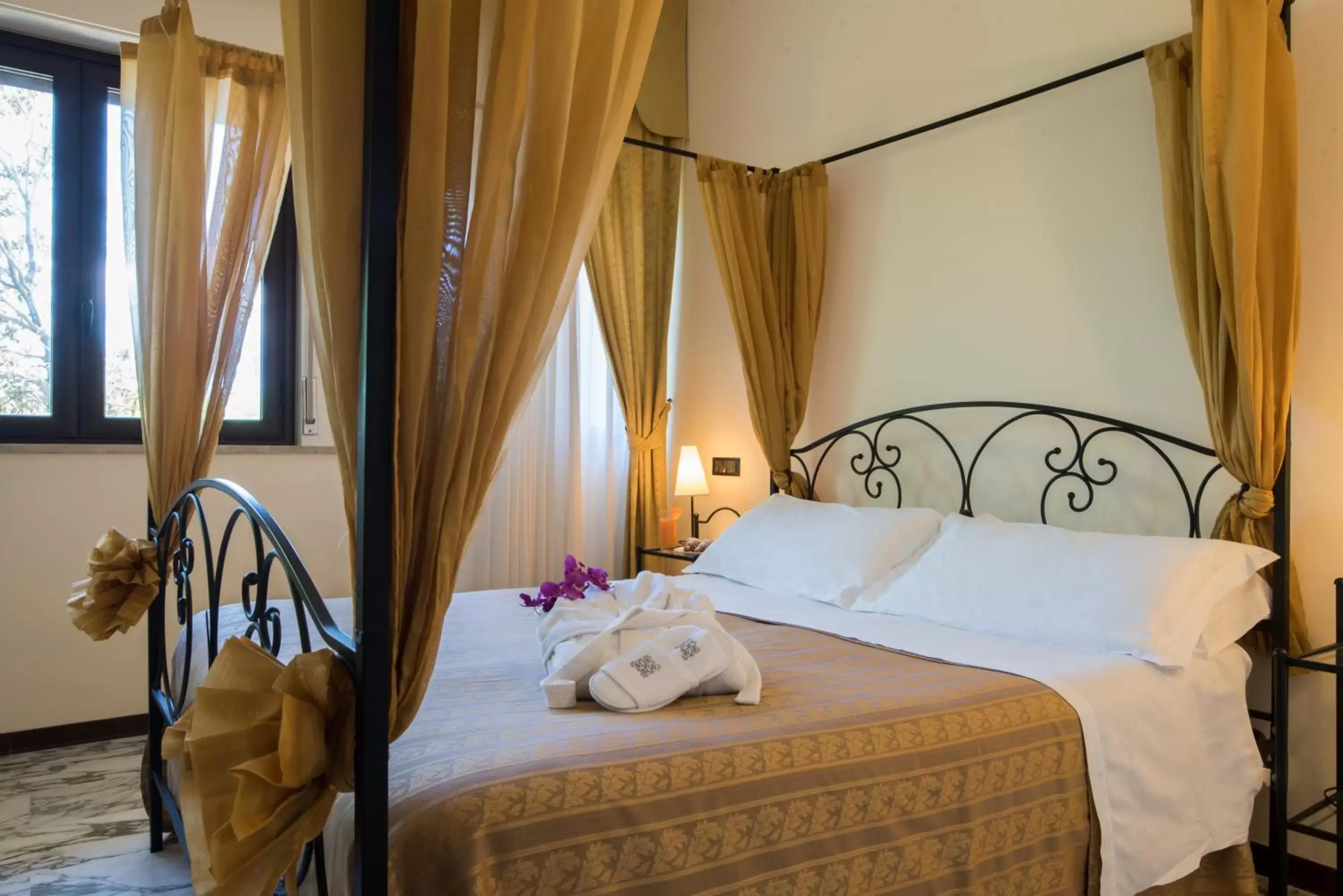 Bed in Villa Morgana Resort and Spa