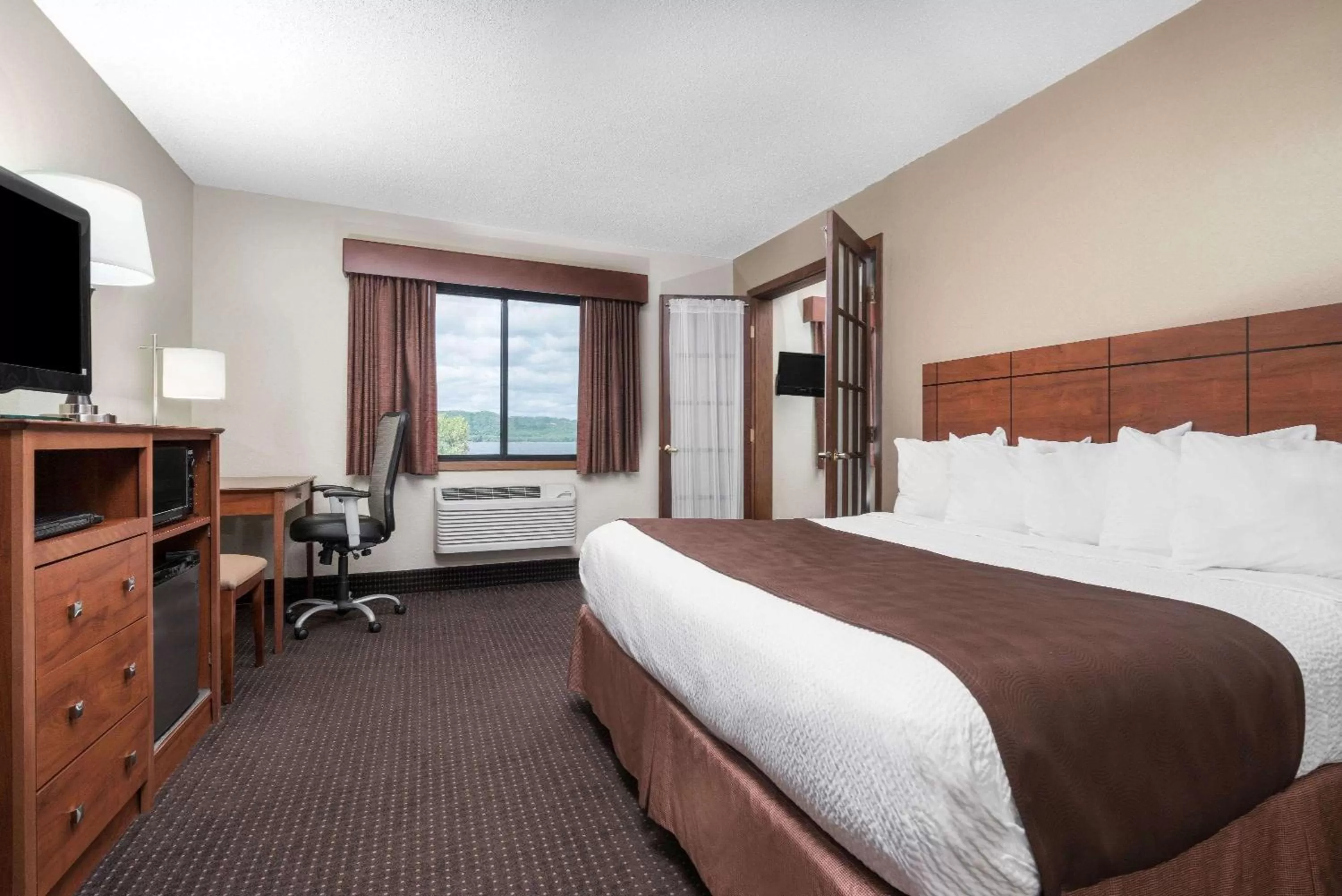 Photo of the whole room, Bed in AmericInn by Wyndham Lake City
