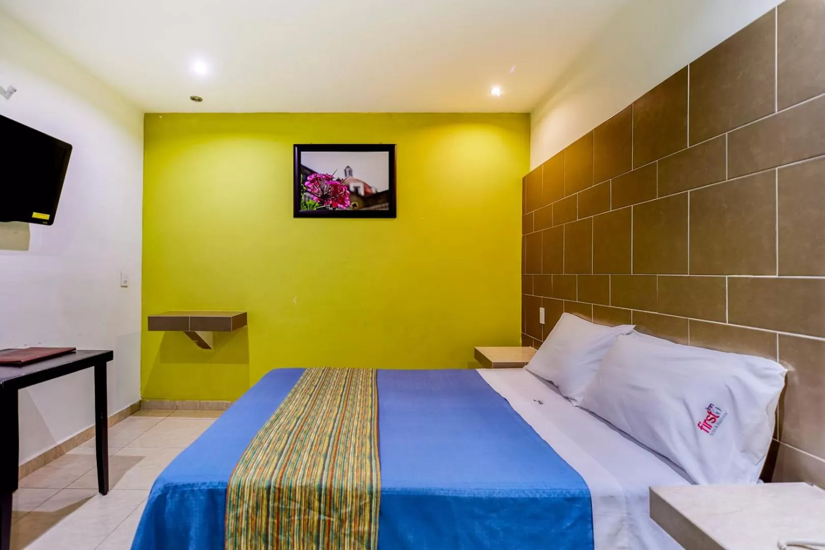 Bed in First Inn Hotel & Business