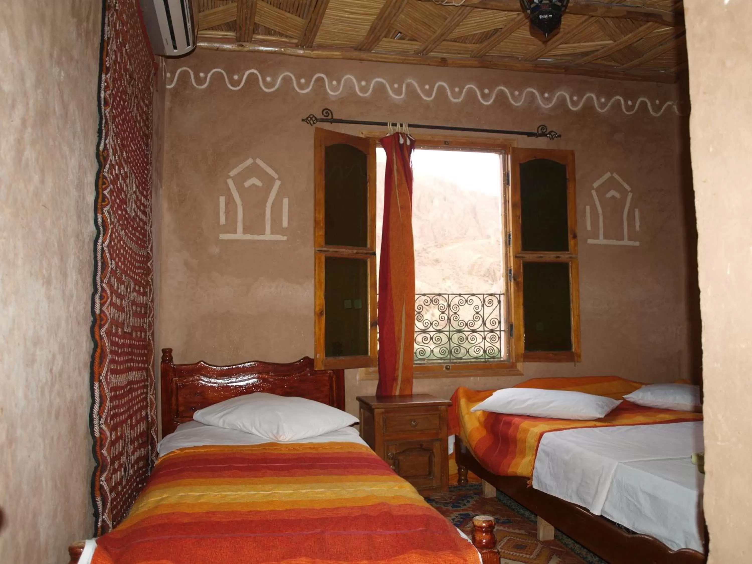 Bed in Maison d'Hôte Valentine