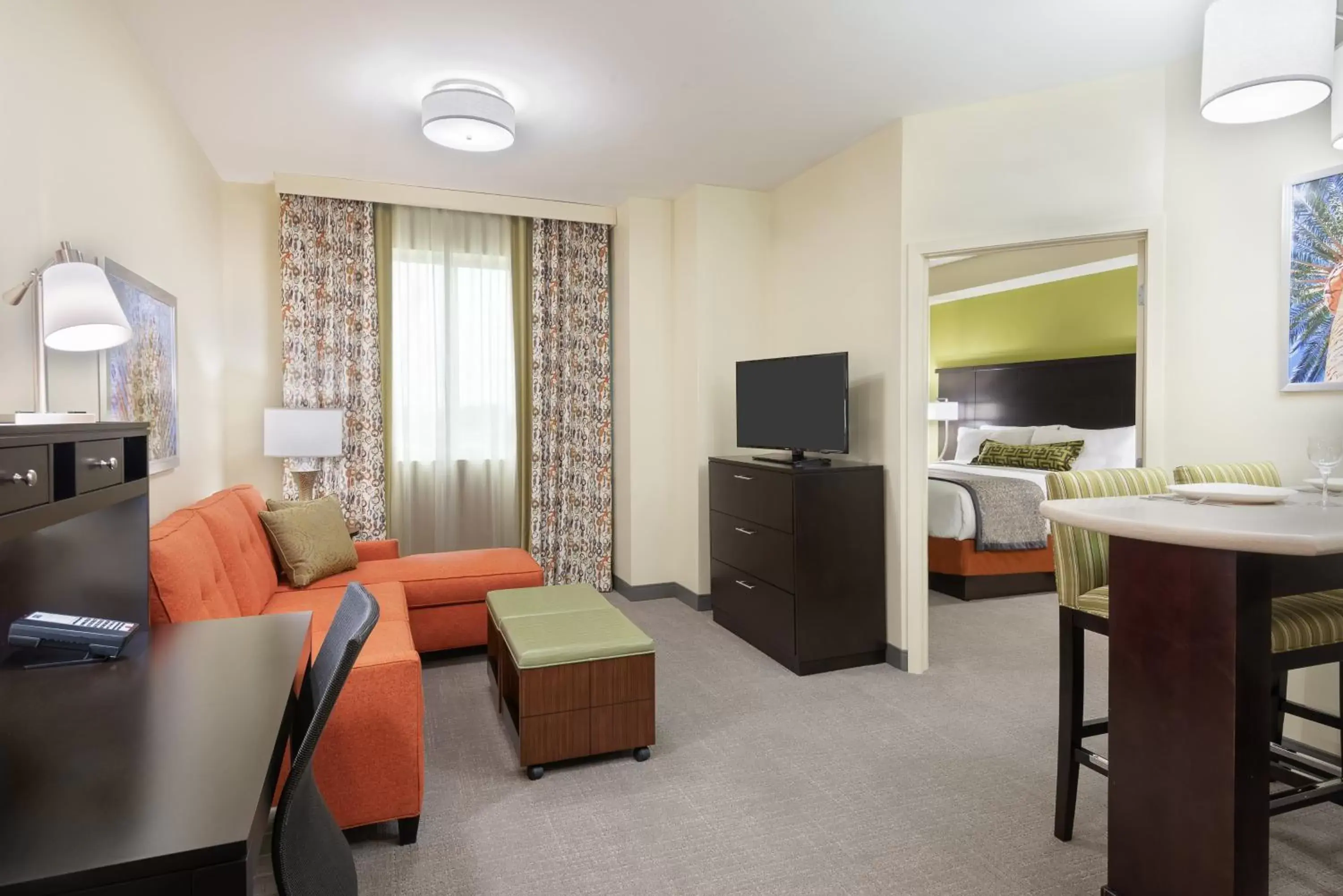 Bedroom, TV/Entertainment Center in Staybridge Suites - Miami International Airport, an IHG Hotel