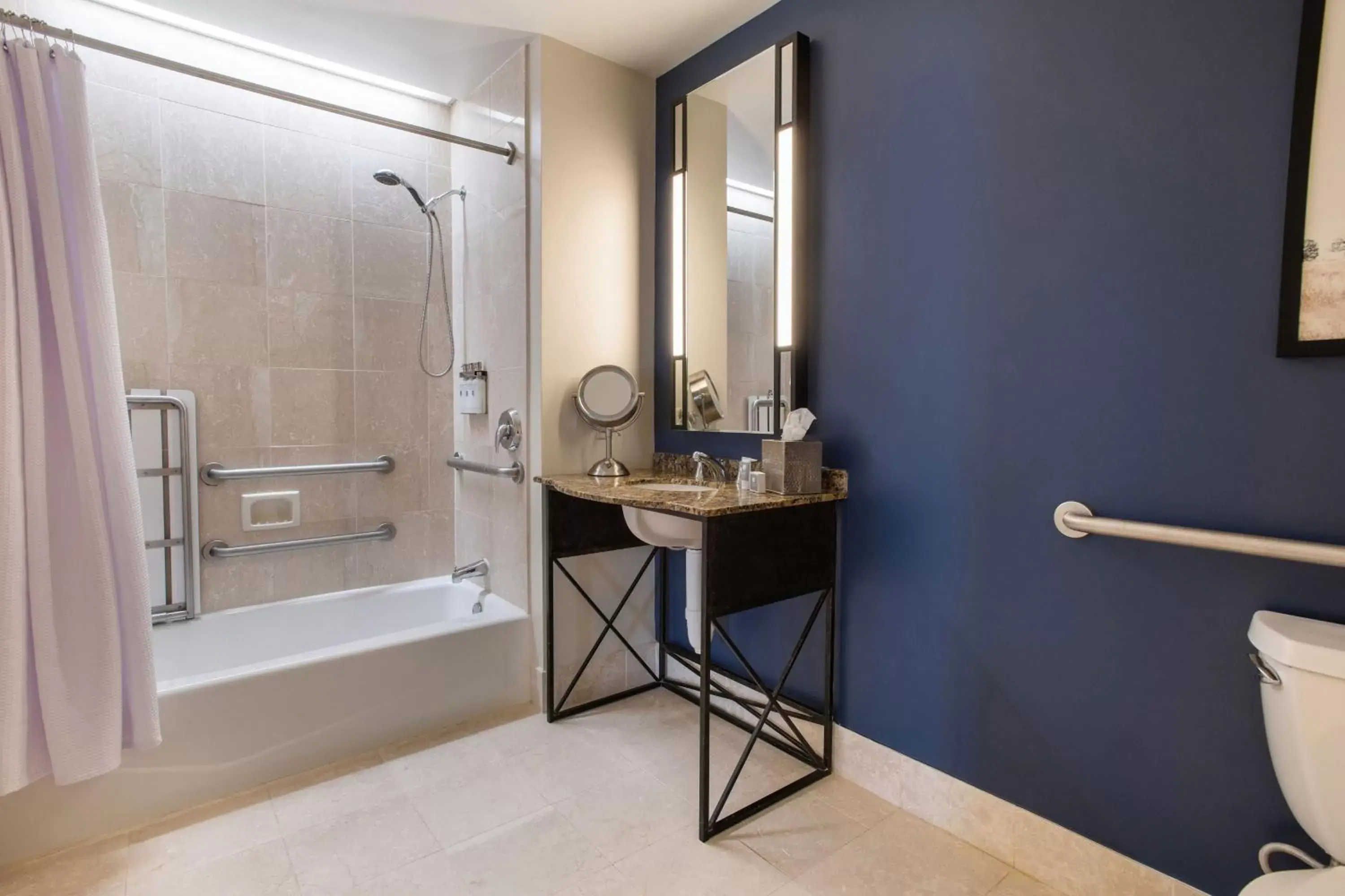 Bathroom in Magnolia Hotel Houston, a Tribute Portfolio Hotel