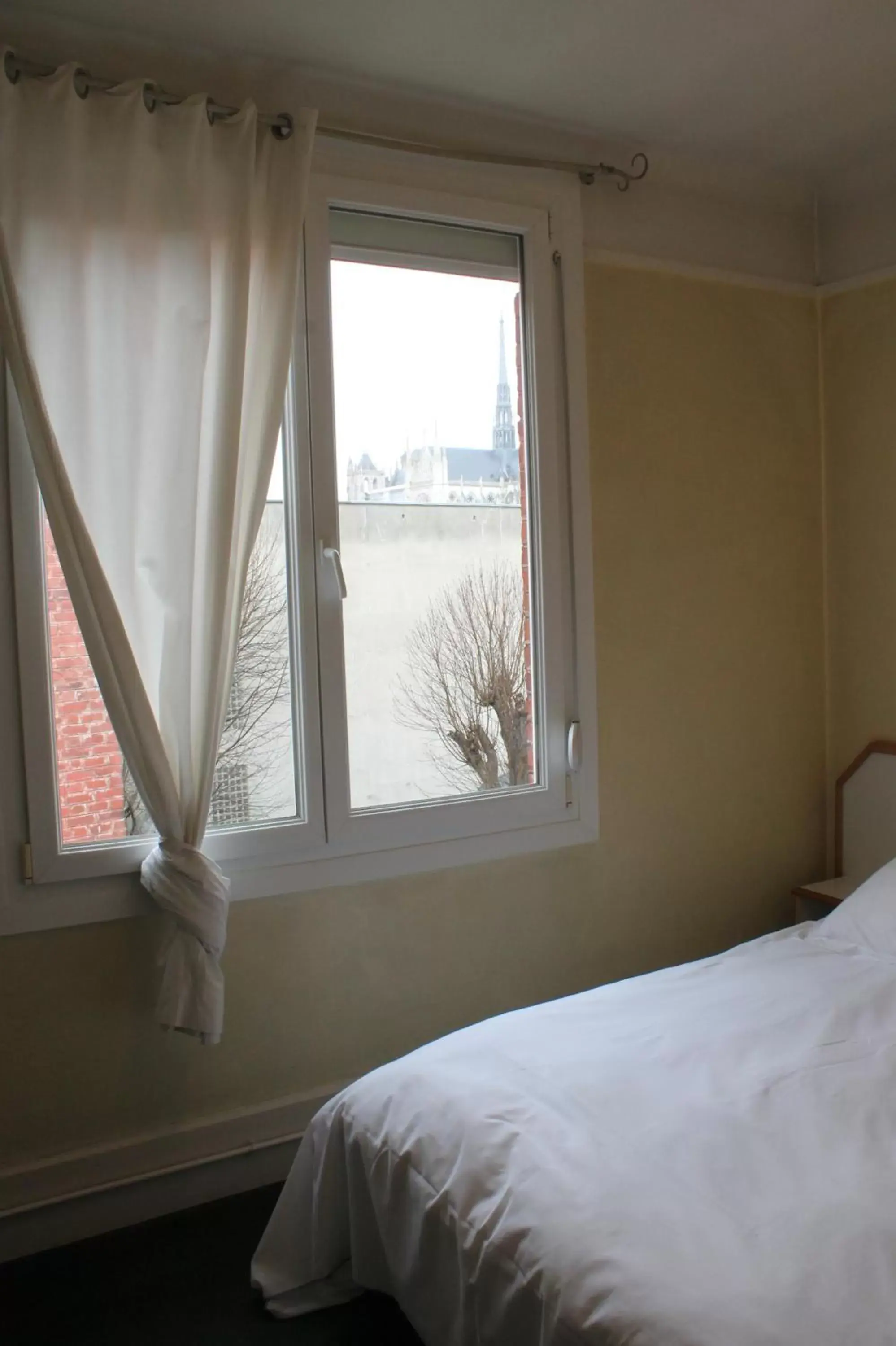 Bedroom in Hôtel De Normandie