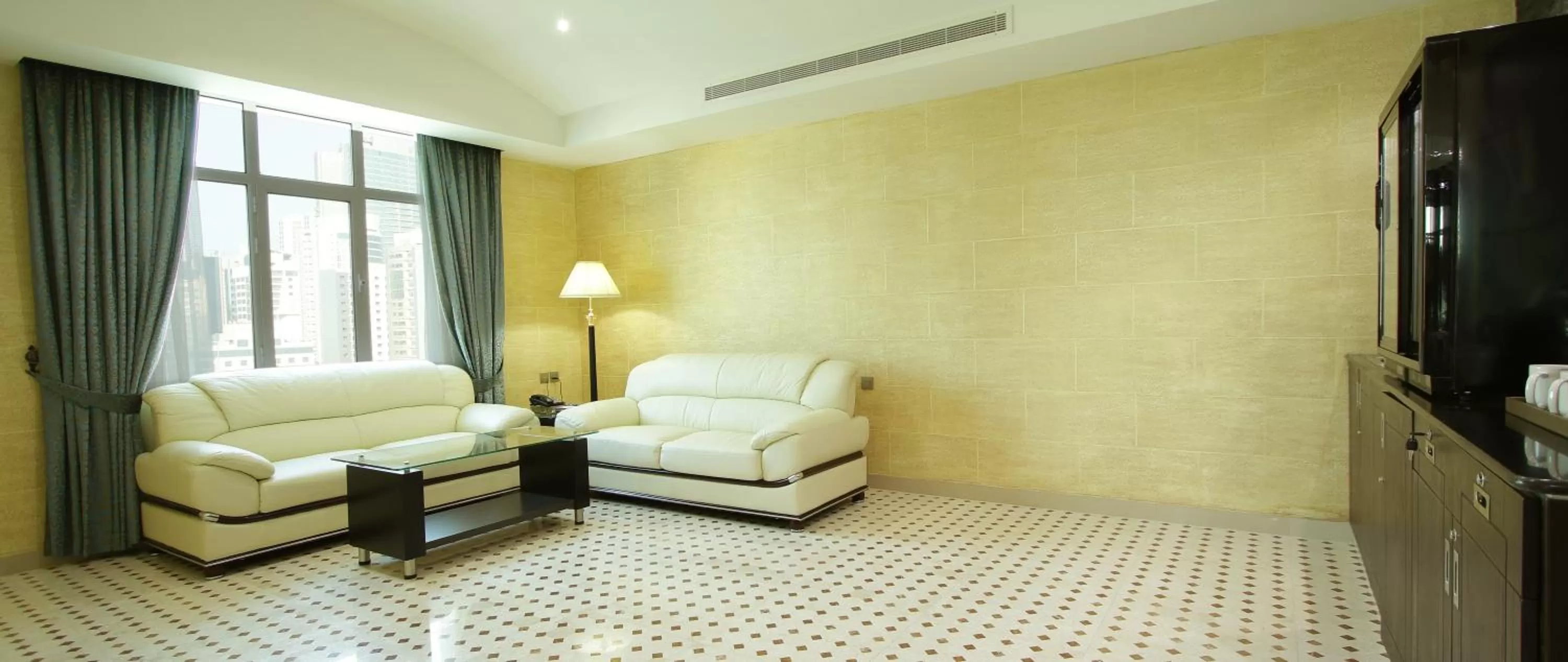 Living room in Park Regis Lotus Hotel