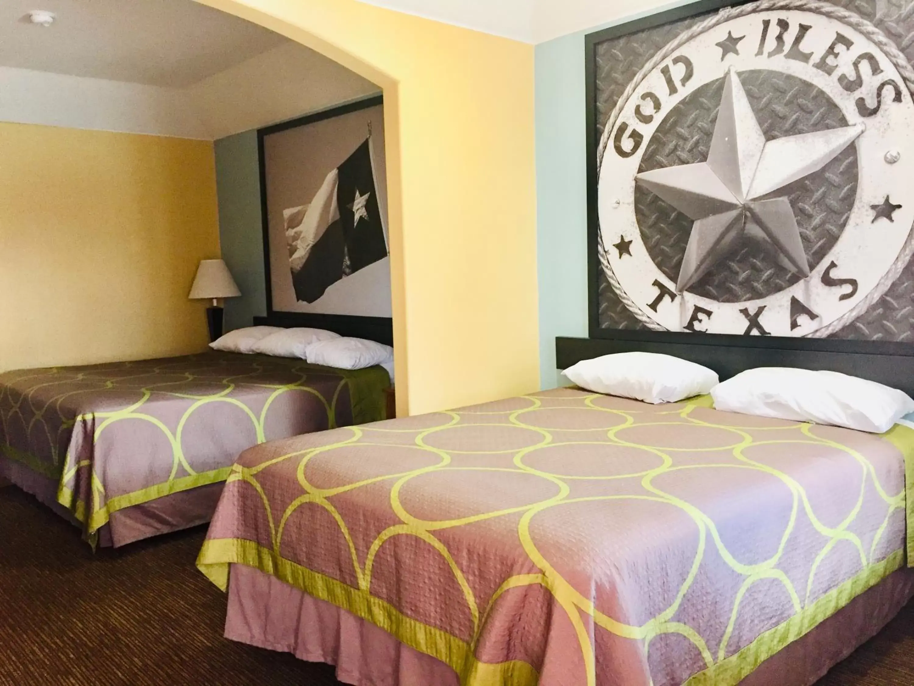 Bed in Super 8 by Wyndham Montgomery/ Lake Conroe