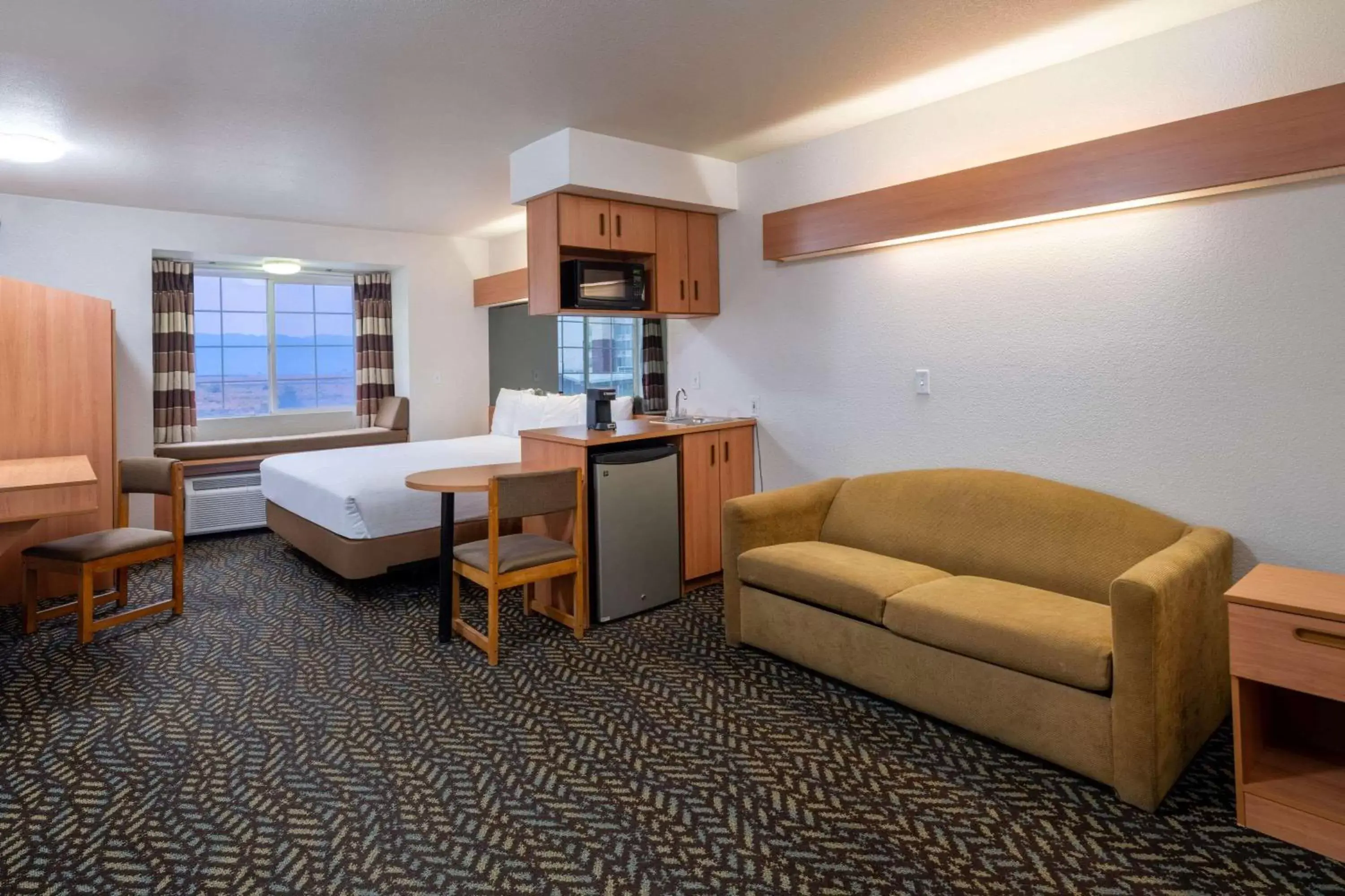 Photo of the whole room, Seating Area in Microtel Inn & Suites by Wyndham Salt Lake City Airport