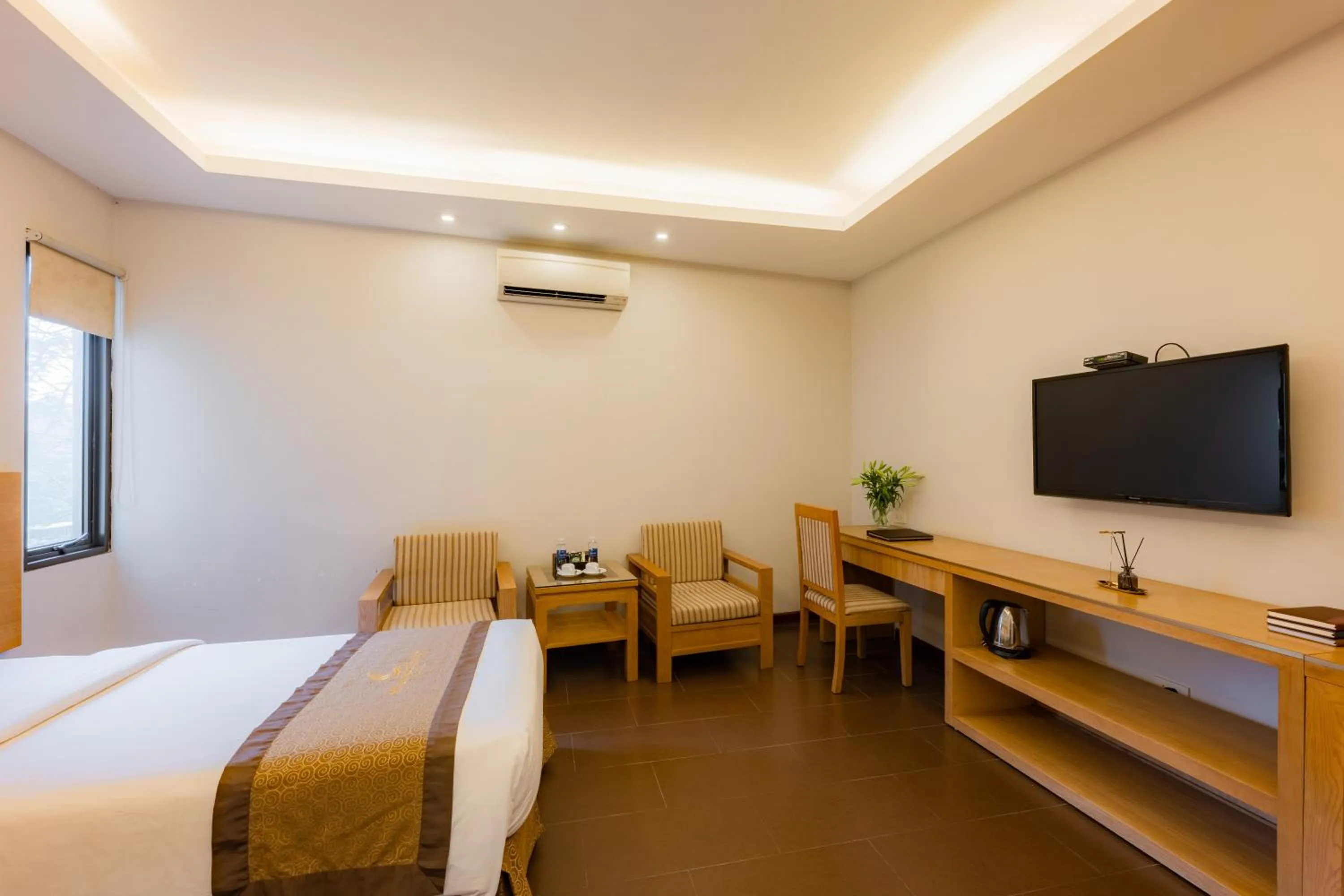 Bed in Riverside Hanoi Hotel