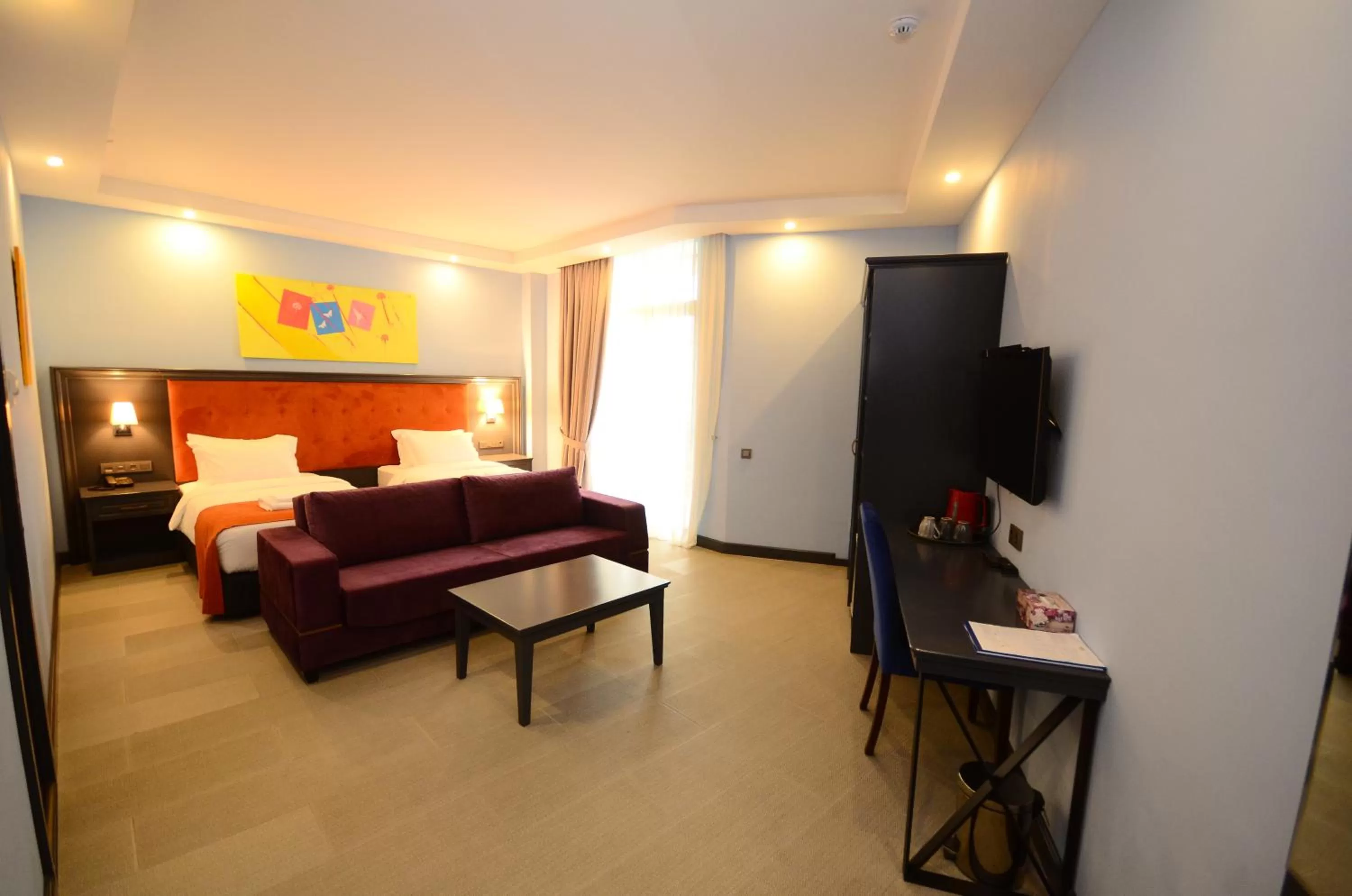 Communal lounge/ TV room, Bed in Batumi Palm Hotel