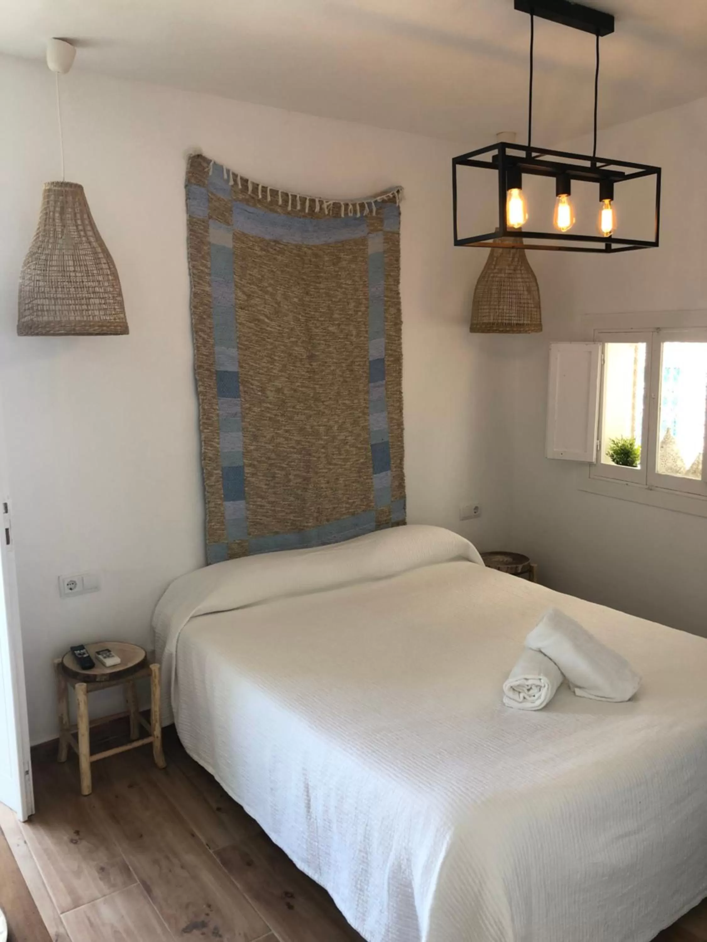 Bed in Blancos Rooms Hotel