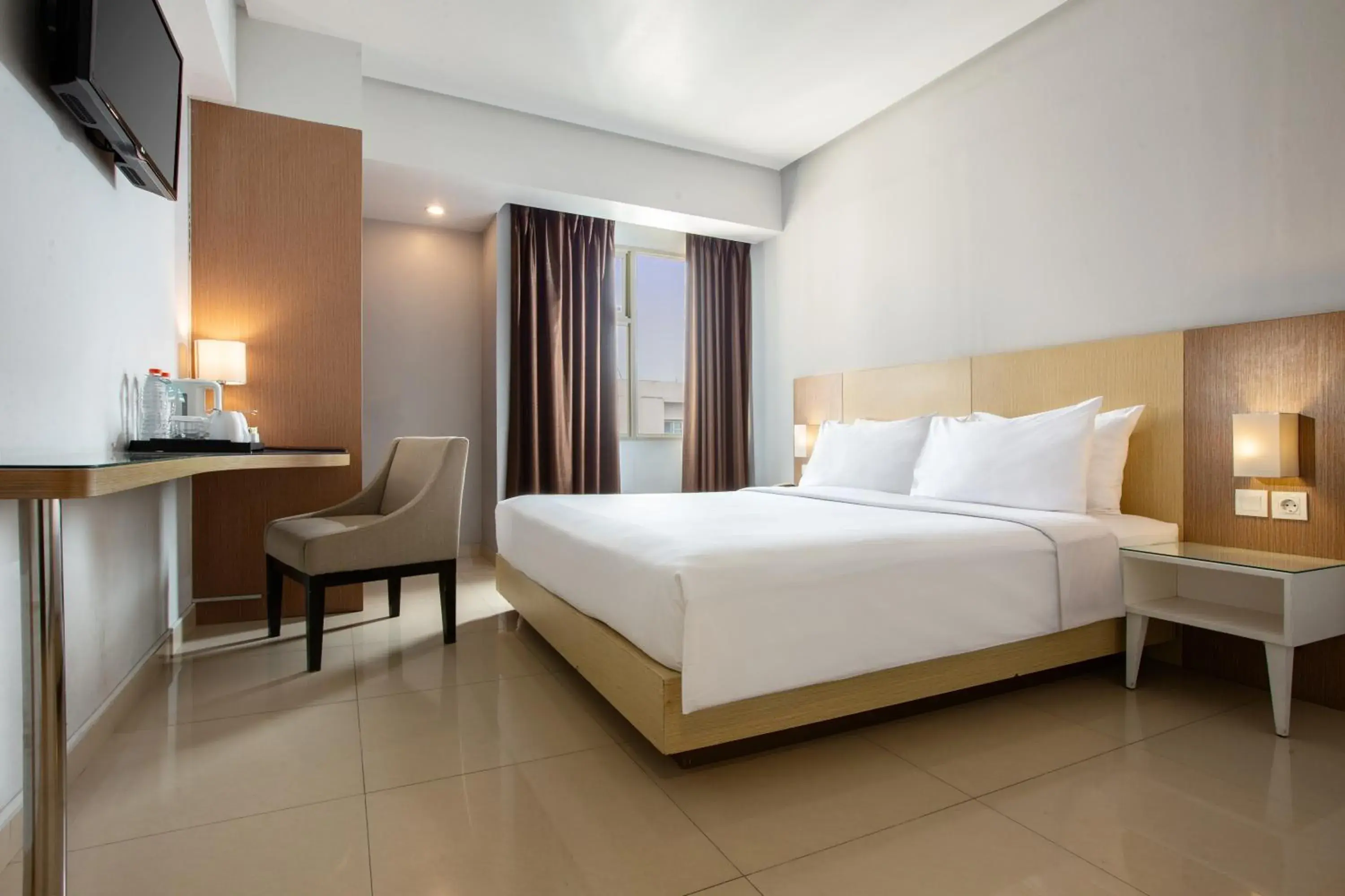 Photo of the whole room, Bed in Hotel Santika Depok