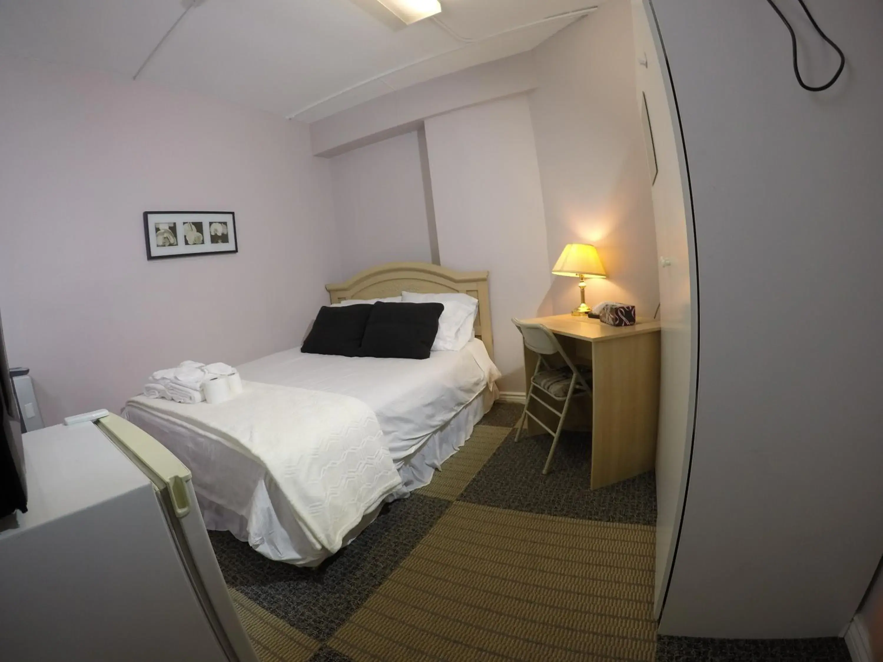 Photo of the whole room, Bed in Saint Lawrence Residences and Suites