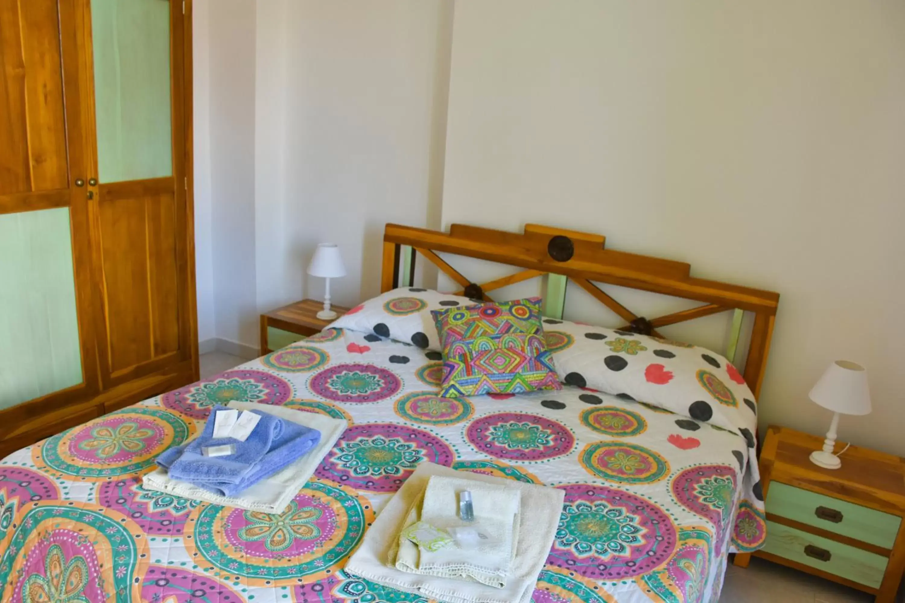 Bed in Flowery Inn Villa