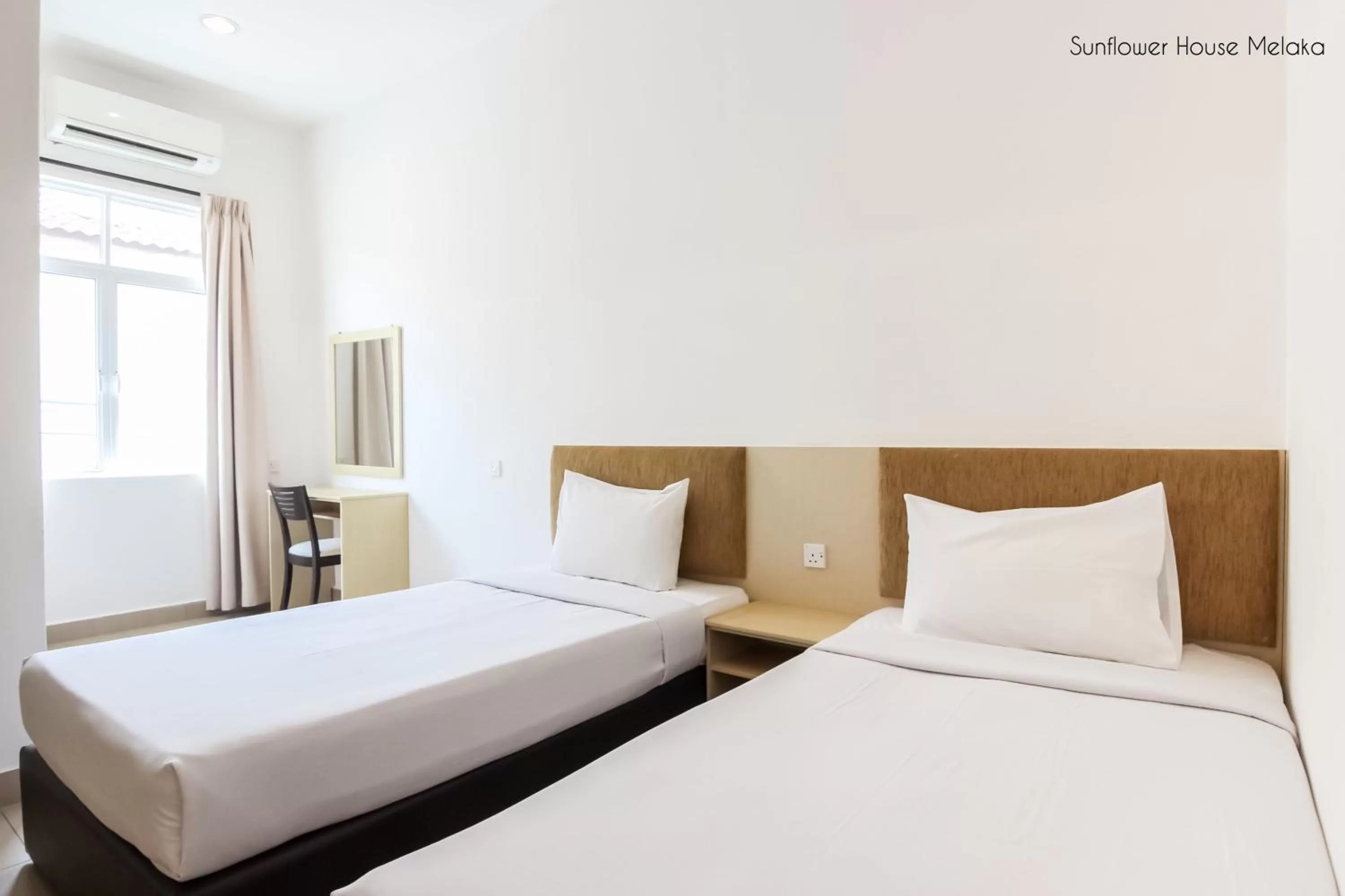 Bed in Sunflower Hotel Malacca