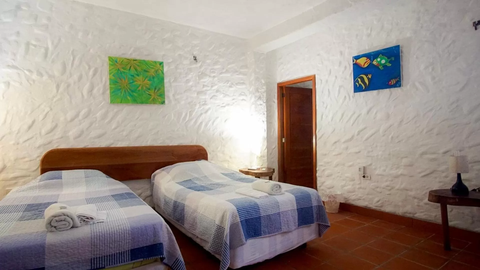 Bed in Hostal Galapagos by Bar de Beto