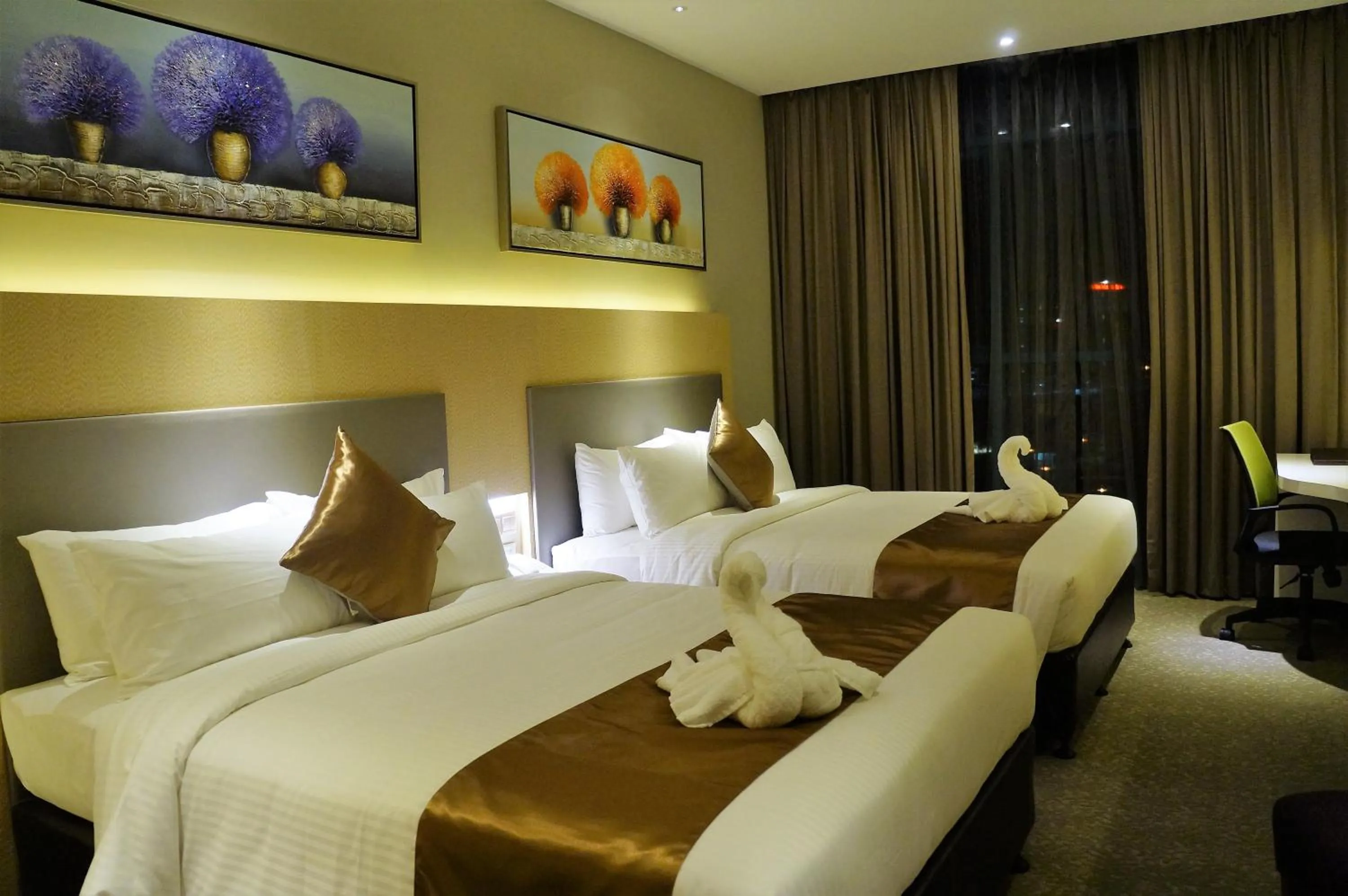 Bed in Greens Hotel & Suites