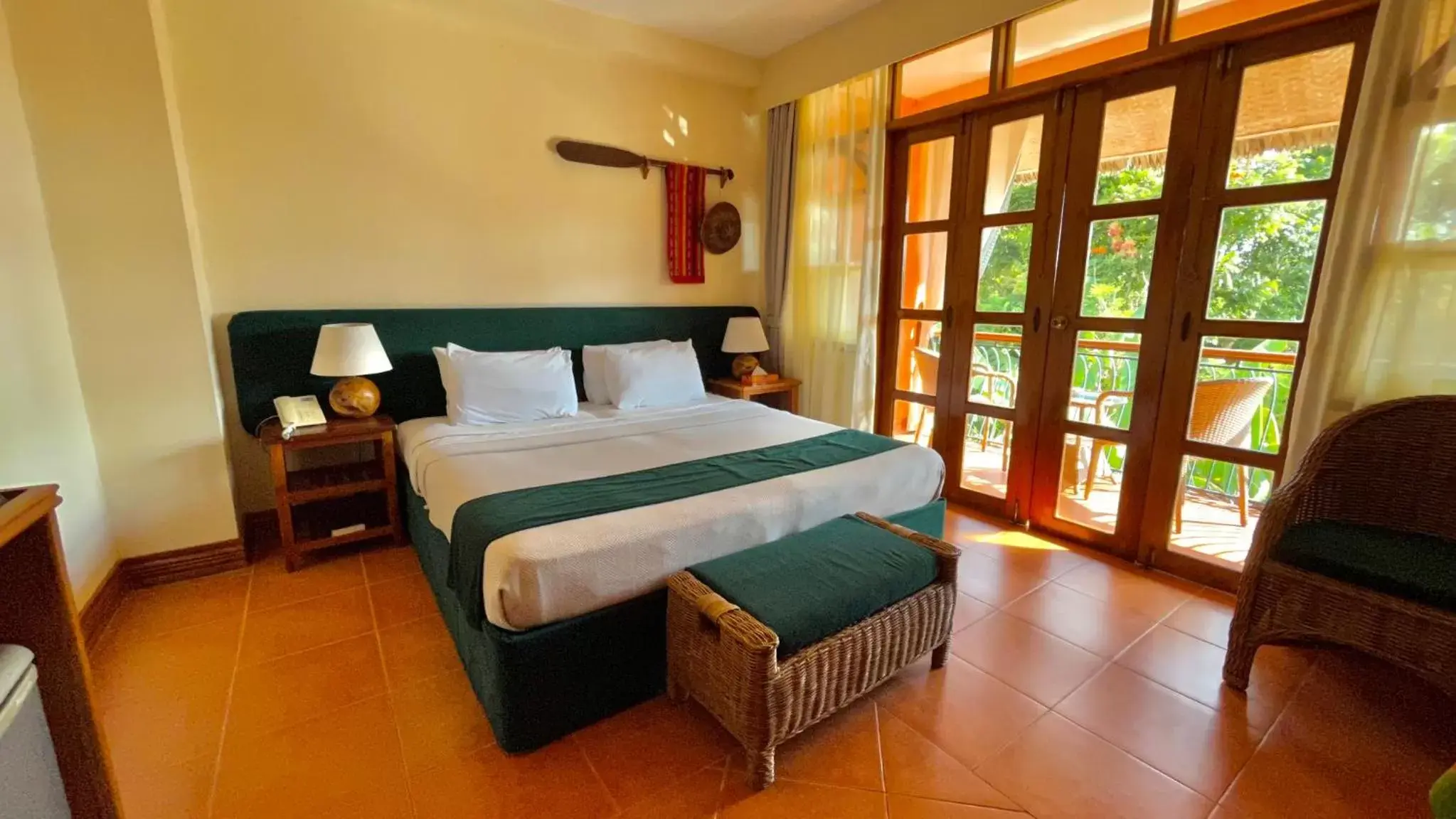 Bed in Coco Grove Beach Resort, Siquijor Island