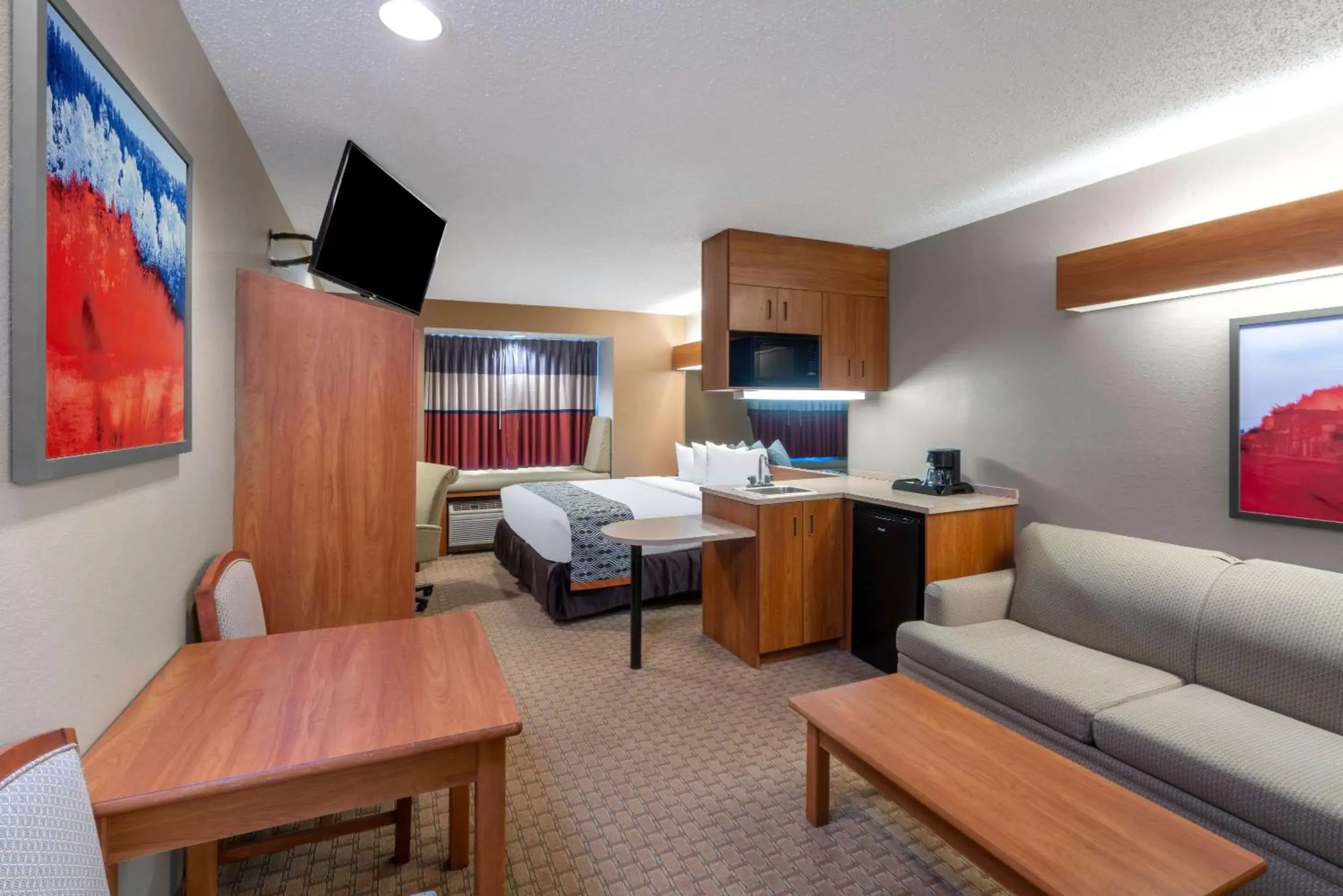 Photo of the whole room, TV/Entertainment Center in Microtel Inn & Suites