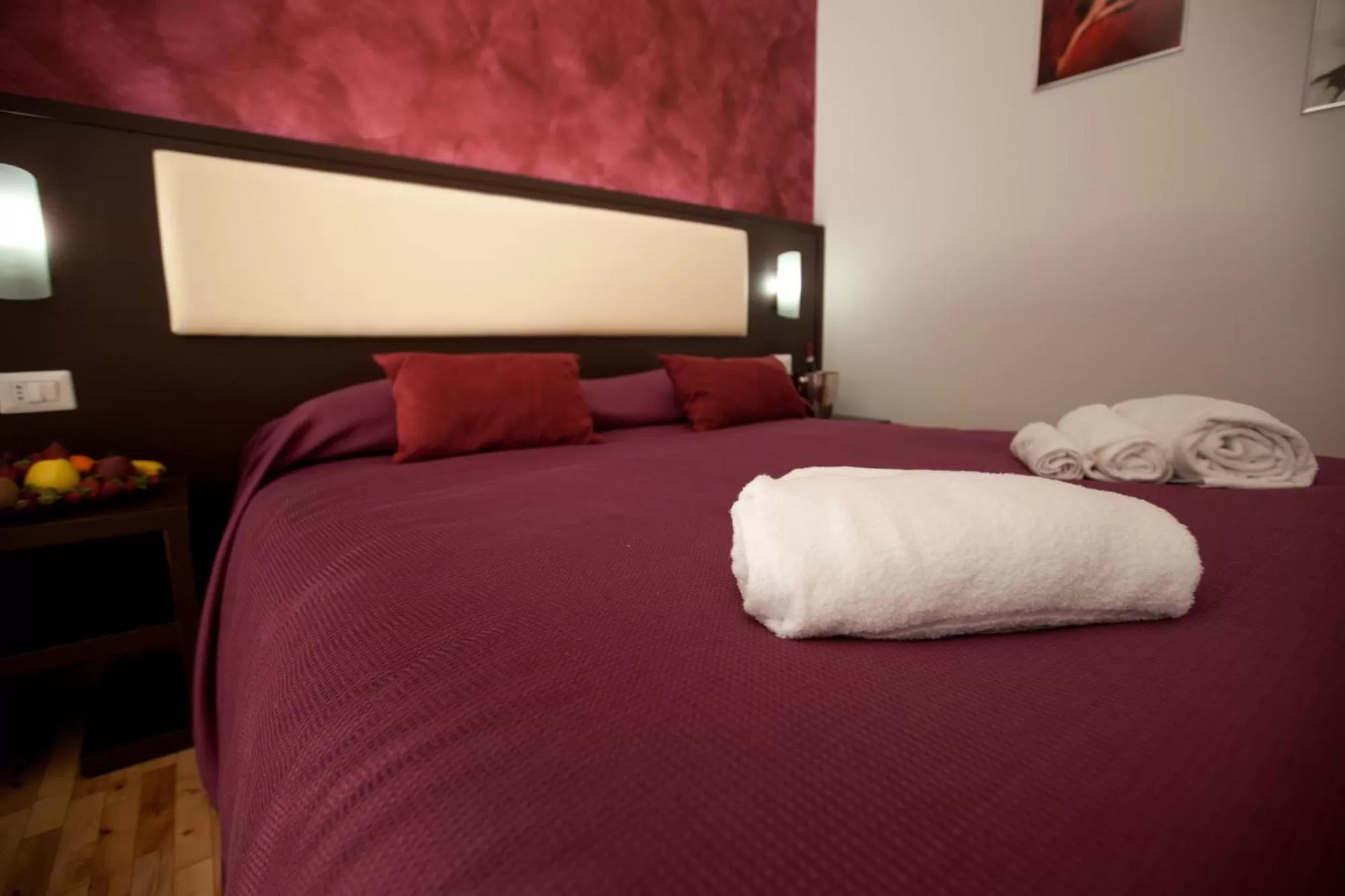 Bed in Heart of Rome Rooms