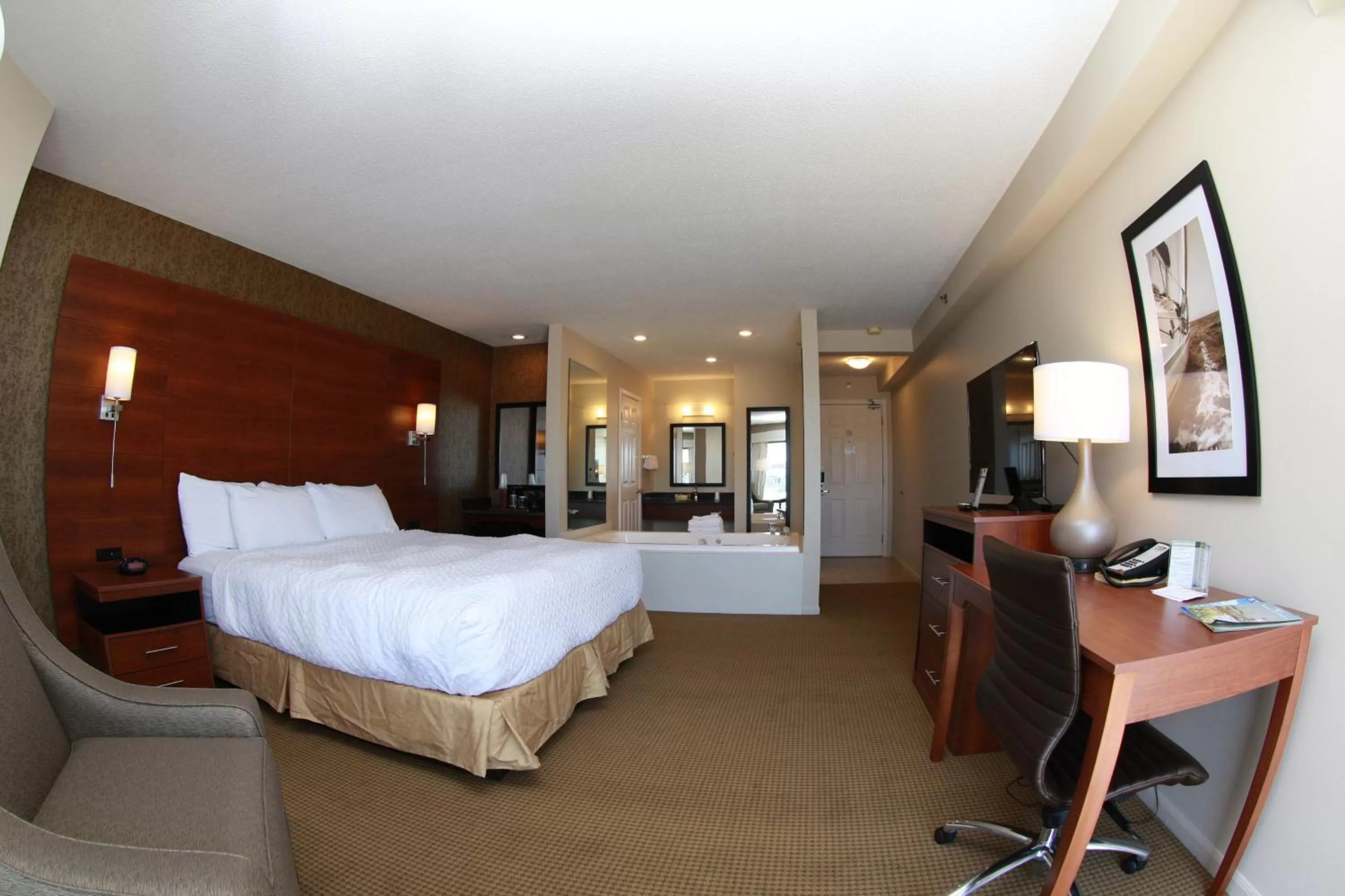 Bed in Budget Host Inn & Suites