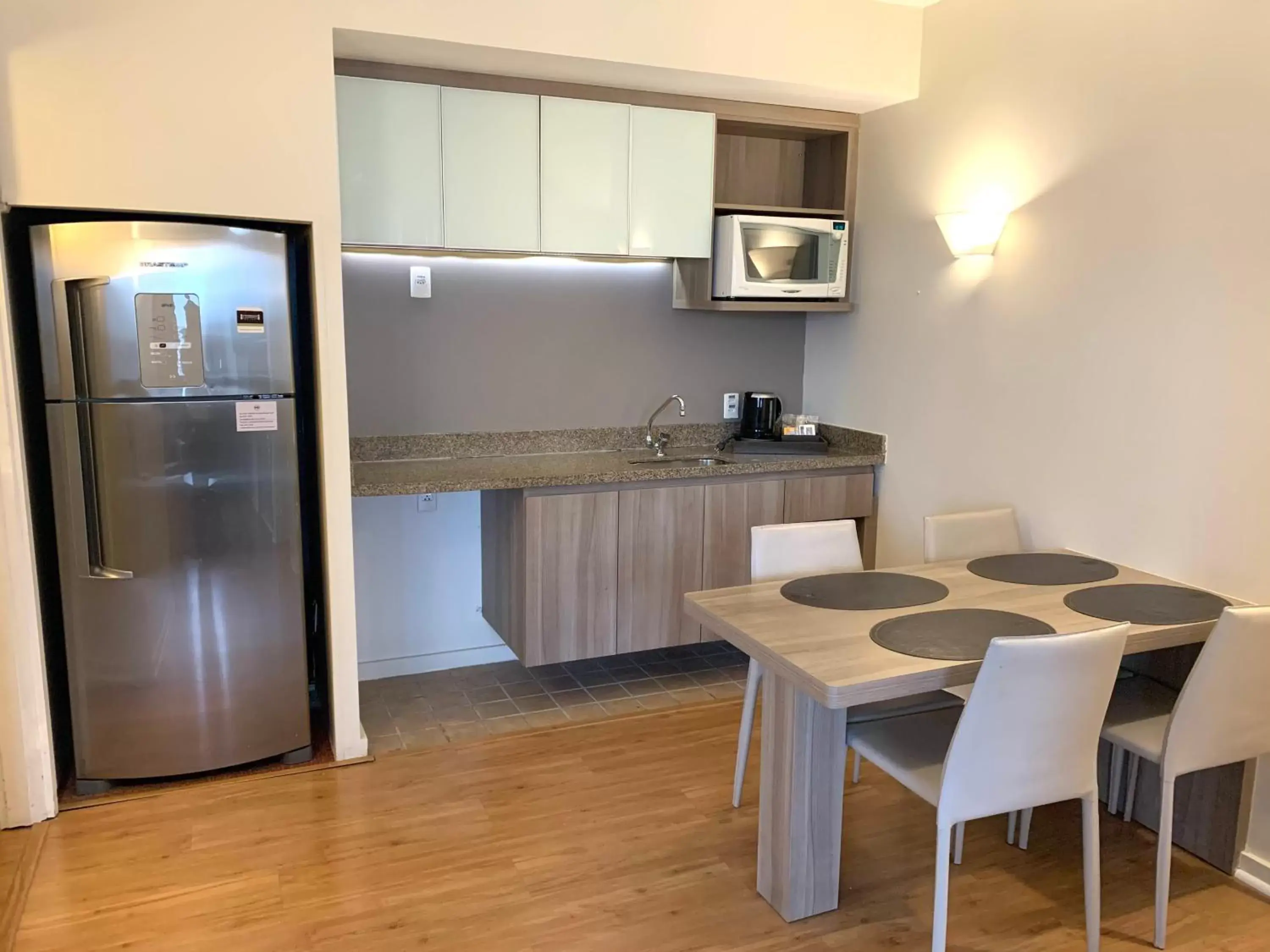 Photo of the whole room, Kitchen/Kitchenette in Staybridge Suites São Paulo, an IHG Hotel