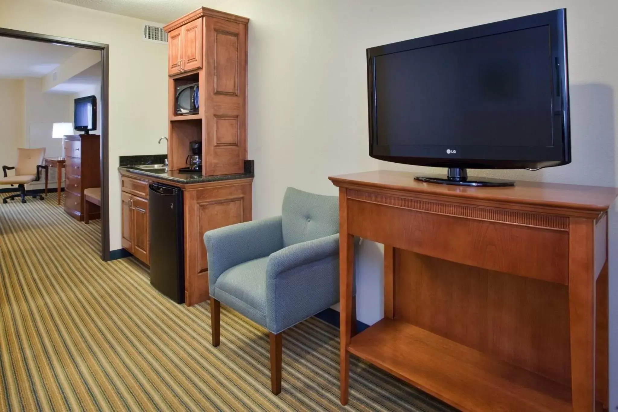 Photo of the whole room, TV/Entertainment Center in Holiday Inn Express Hotel & Suites Fredericksburg, an IHG Hotel