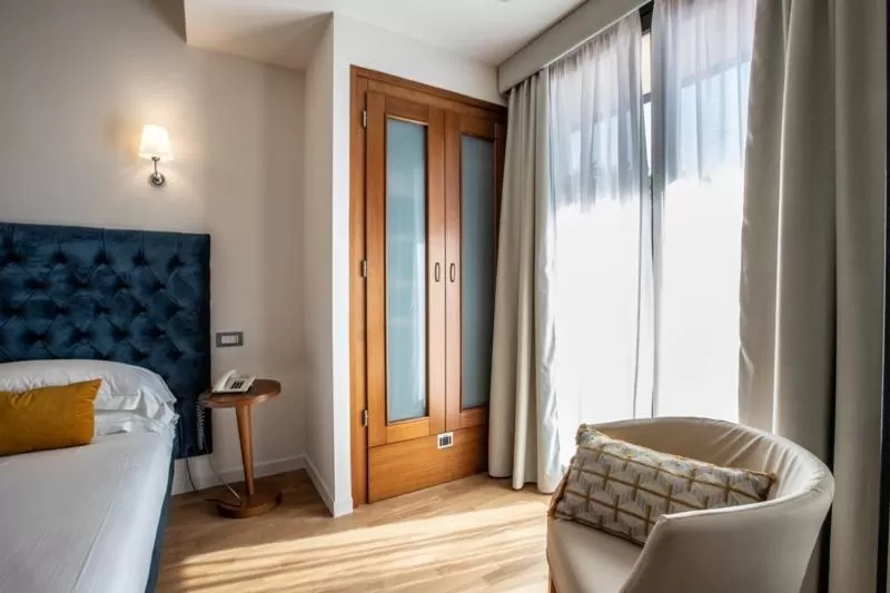 Bed in Dal Moro Gallery Hotel