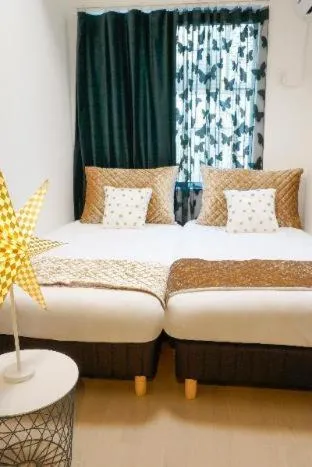 Bed in Blue Empire Hotel