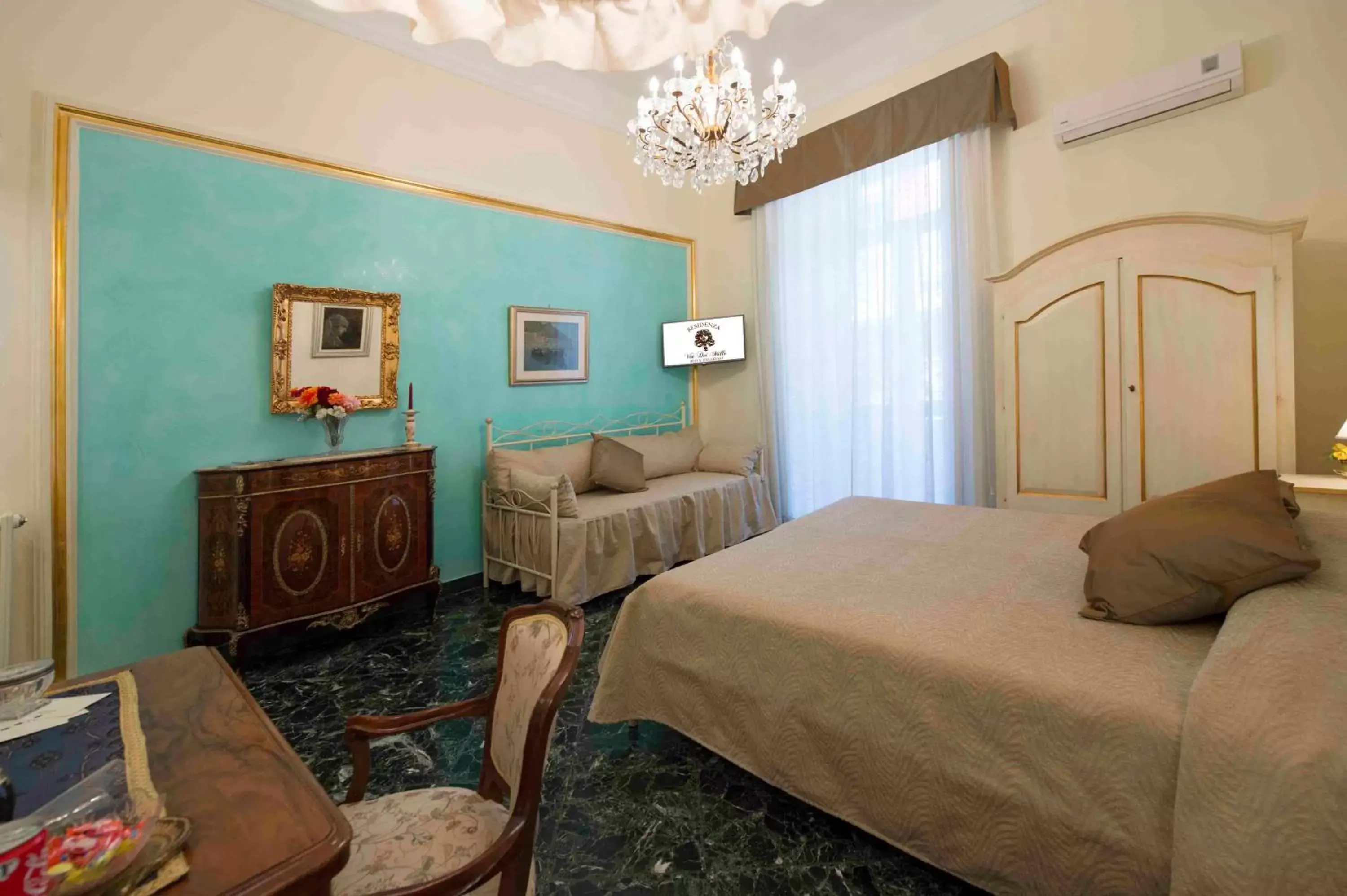 Photo of the whole room in B&B Residenza Via Dei Mille