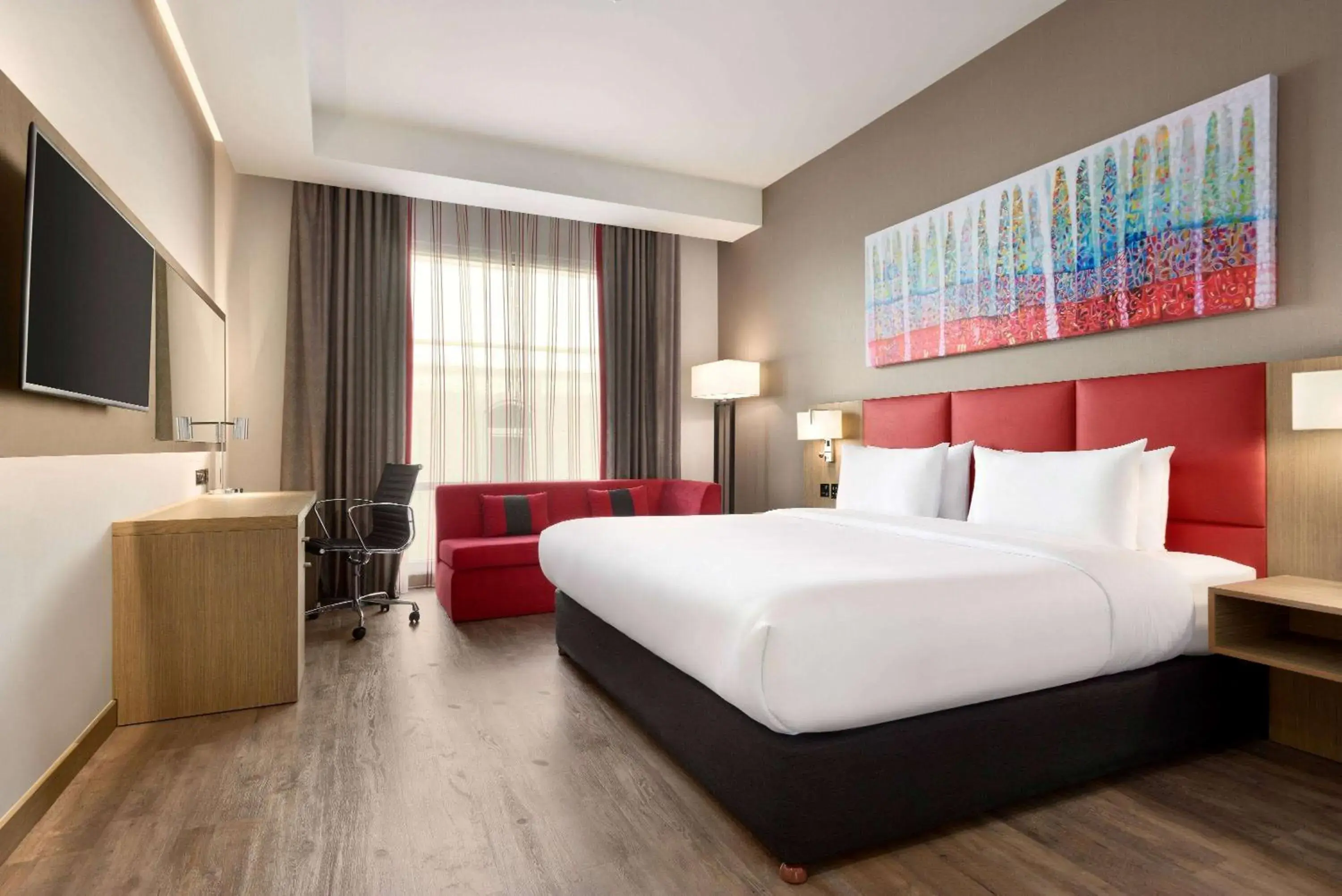 Photo of the whole room, Bed in Ramada Encore by Wyndham Muscat Al-Ghubra