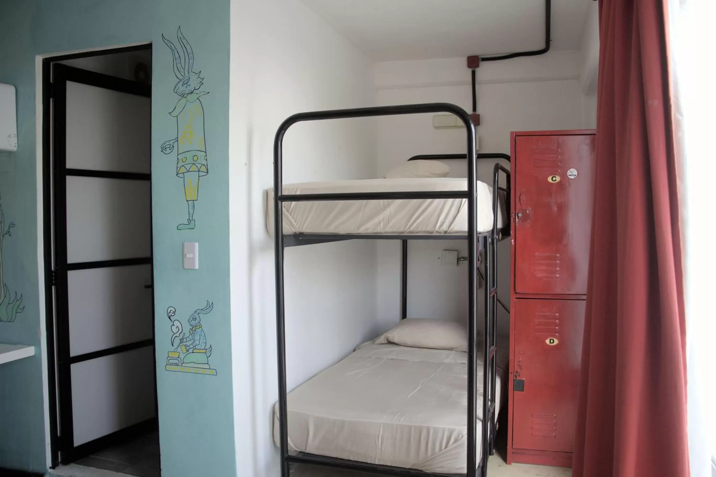 Photo of the whole room, Bunk Bed in Hotel & Hostal Casa de Luz Cancun