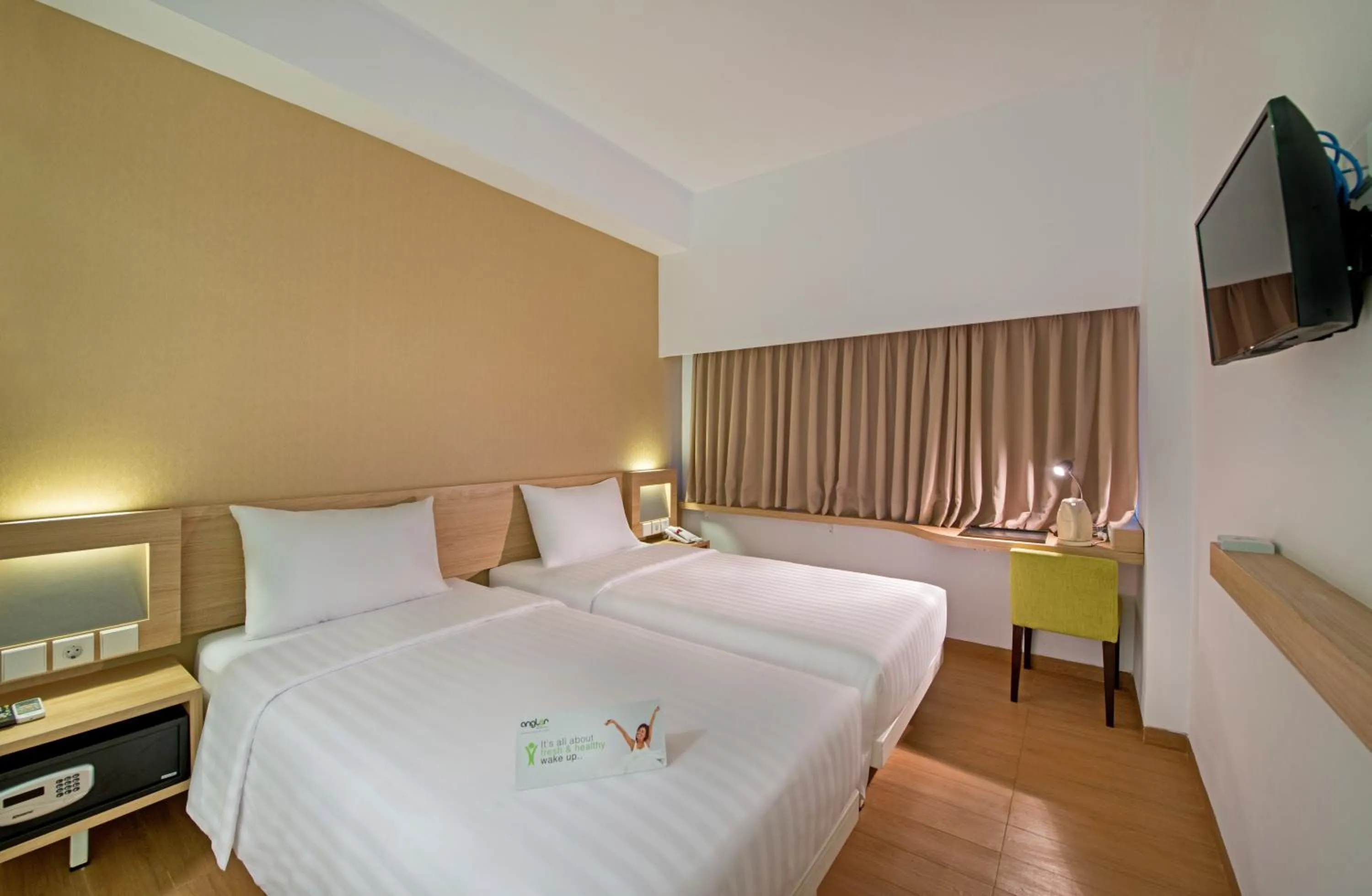 Bed in Whiz Prime Hotel Megamas Manado