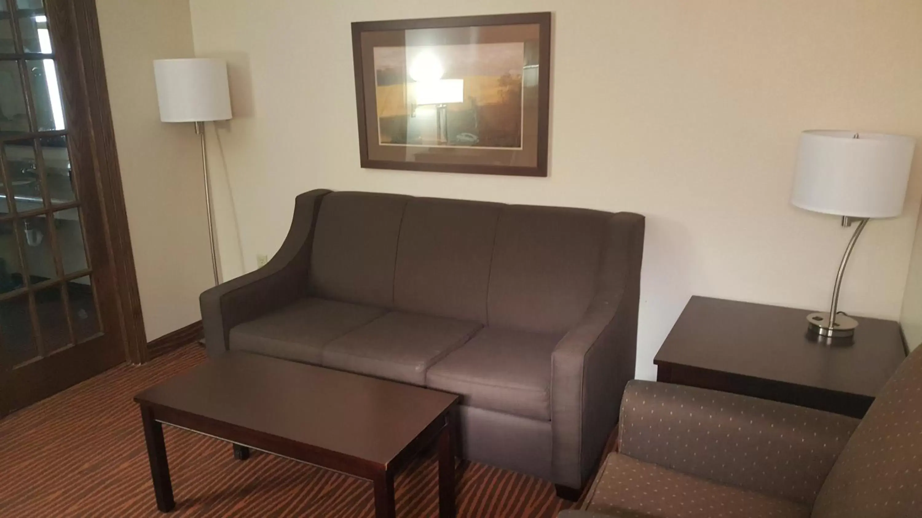 Seating Area in AmericInn by Wyndham Muscatine