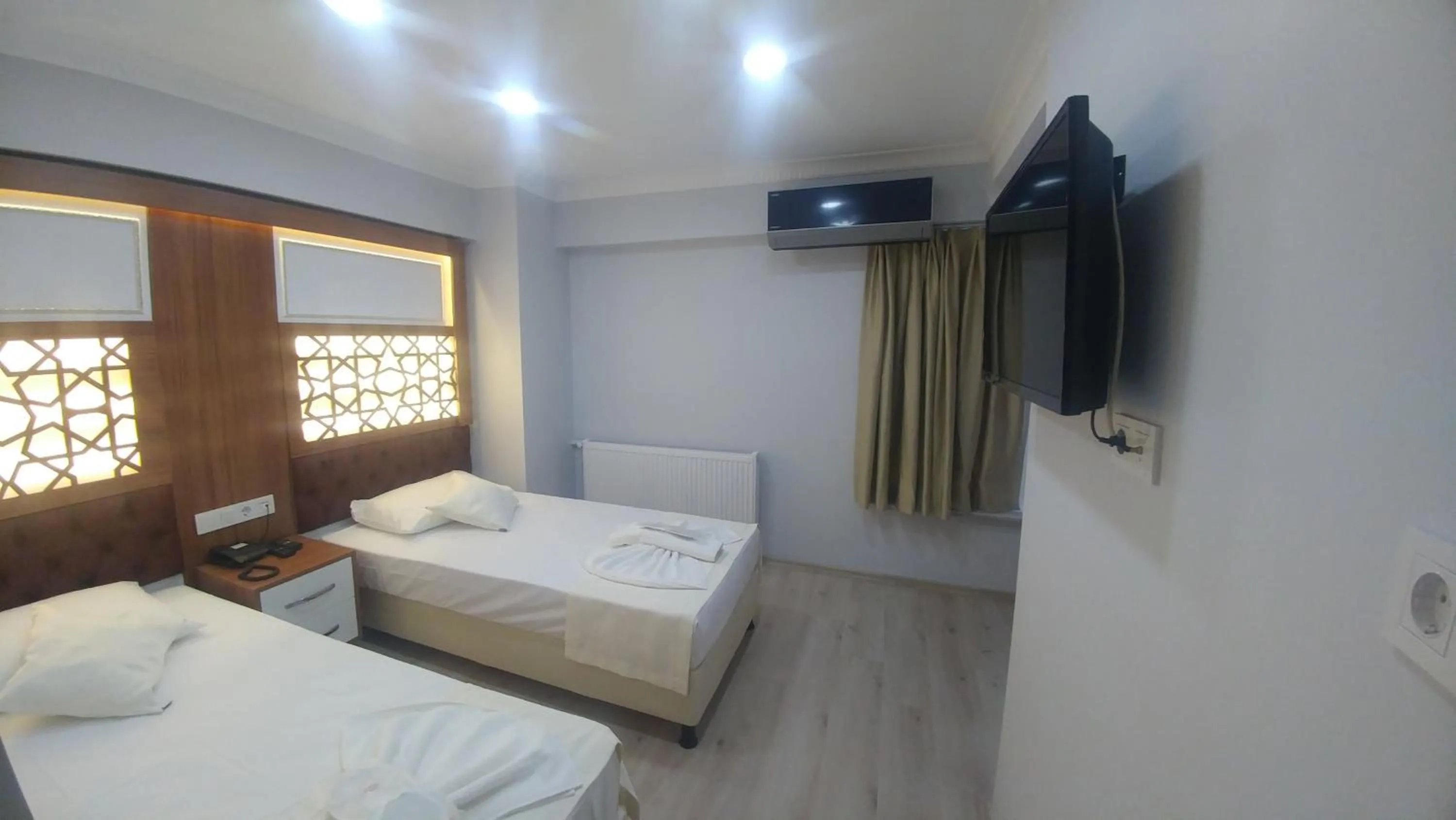 Bed in Grand Liza Hotel