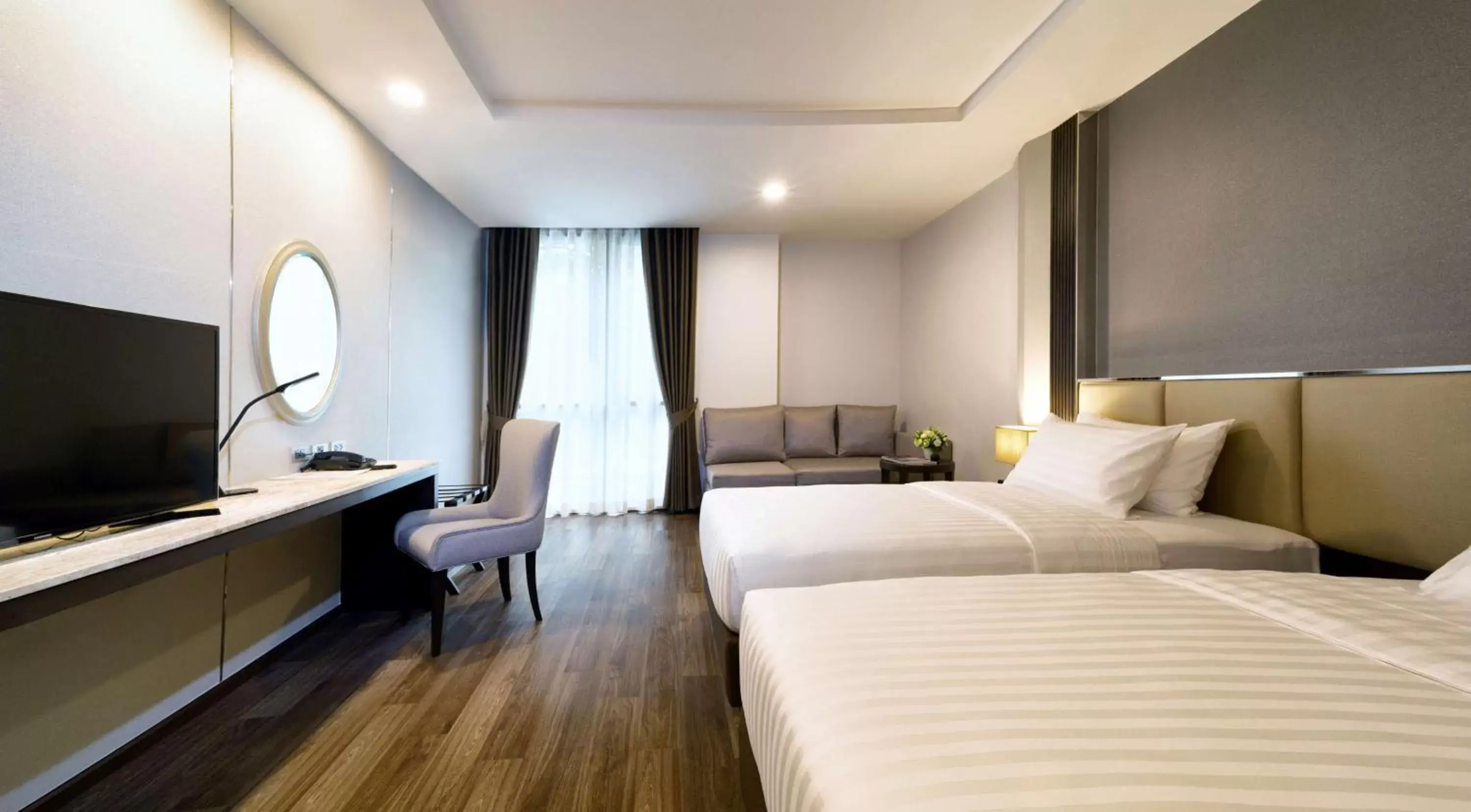 Bedroom in SureStay Plus Hotel by Best Western Sukhumvit 2