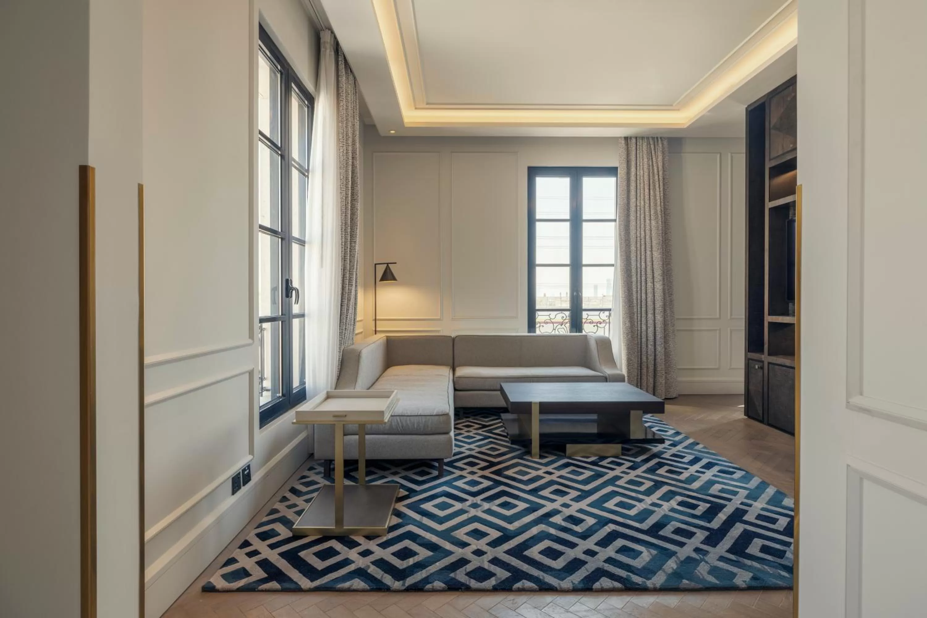 Seating area, Bed in Mansard Riyadh, a Radisson Collection Hotel