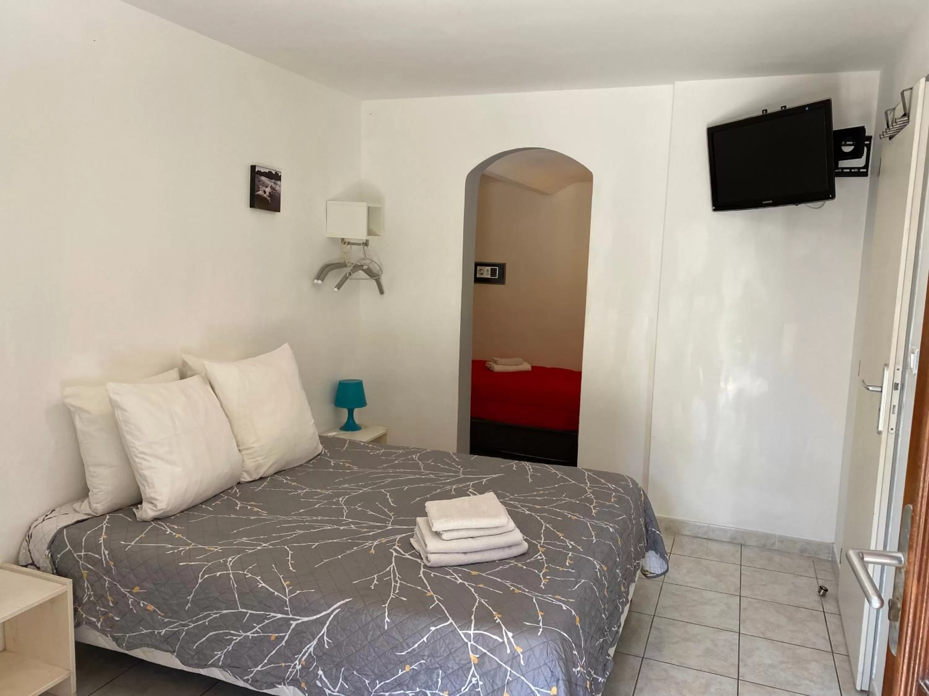 Bed in LOGIS Hôtel La Chaumière