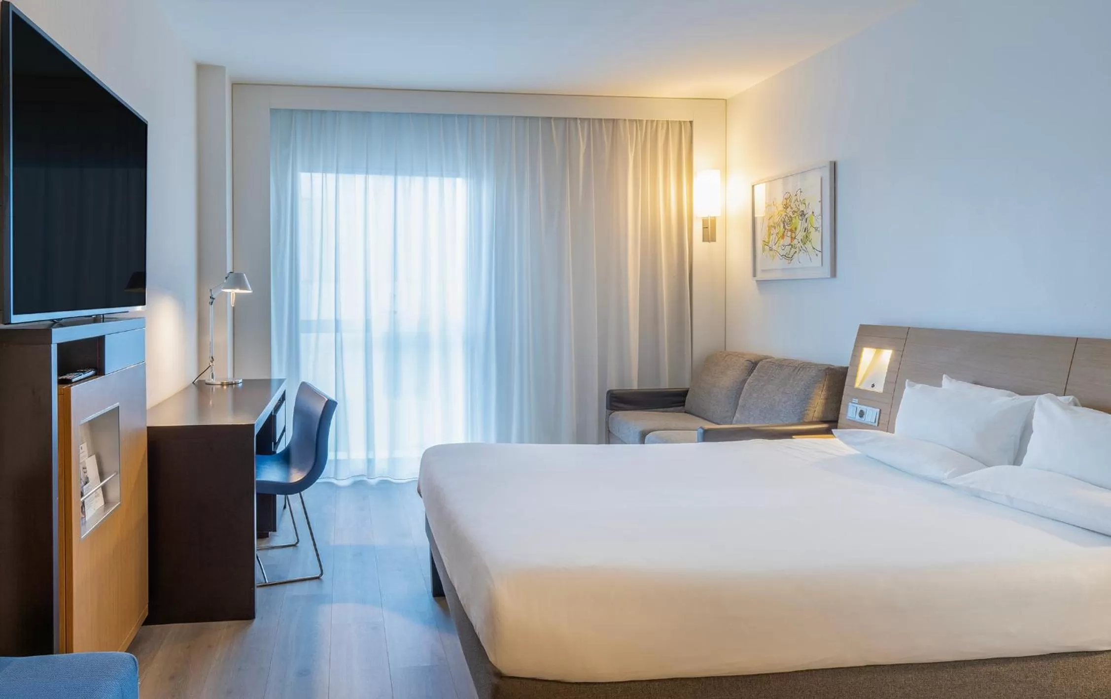 Bed in Novotel Barcelona City