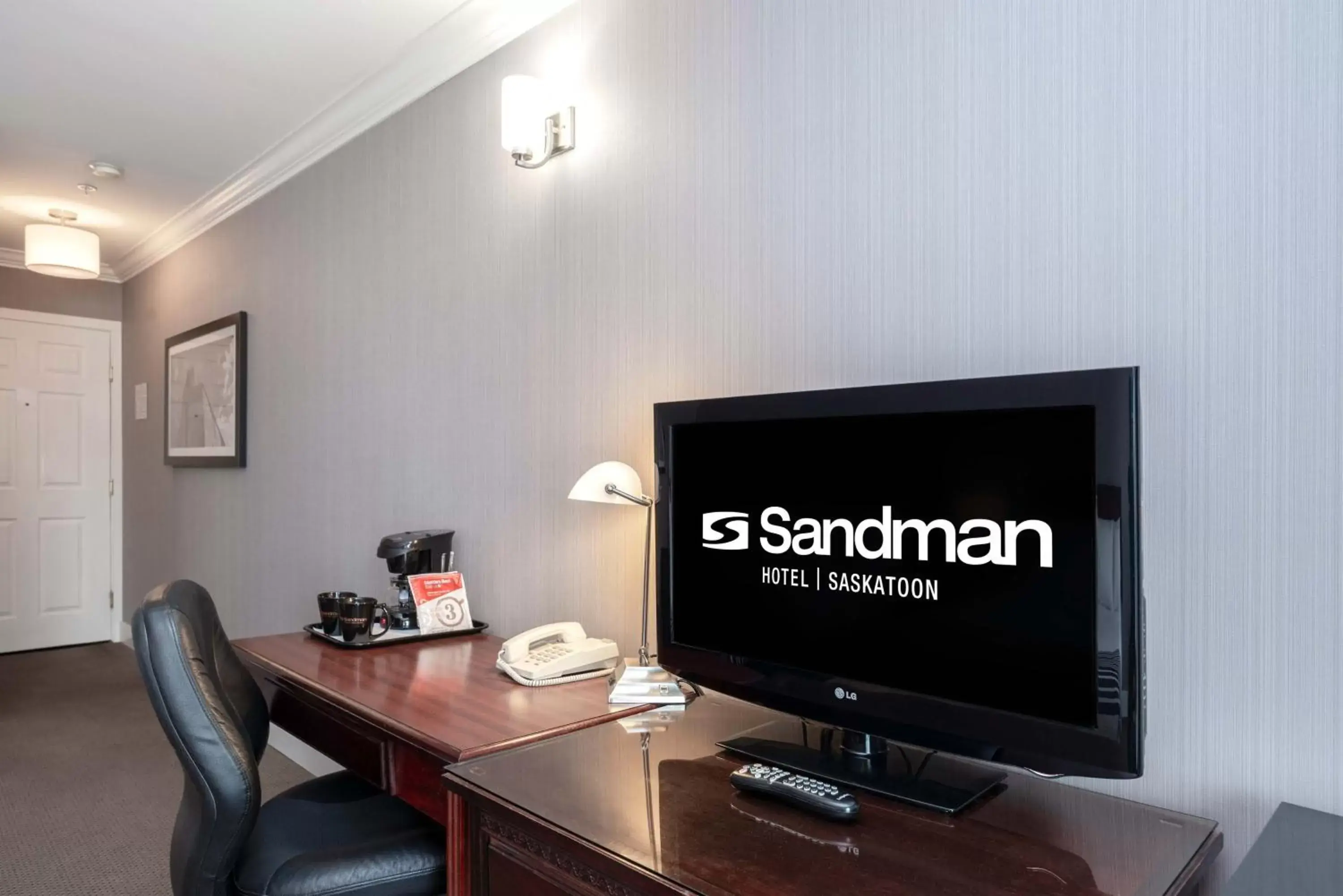 Photo of the whole room, TV/Entertainment Center in Sandman Hotel Saskatoon