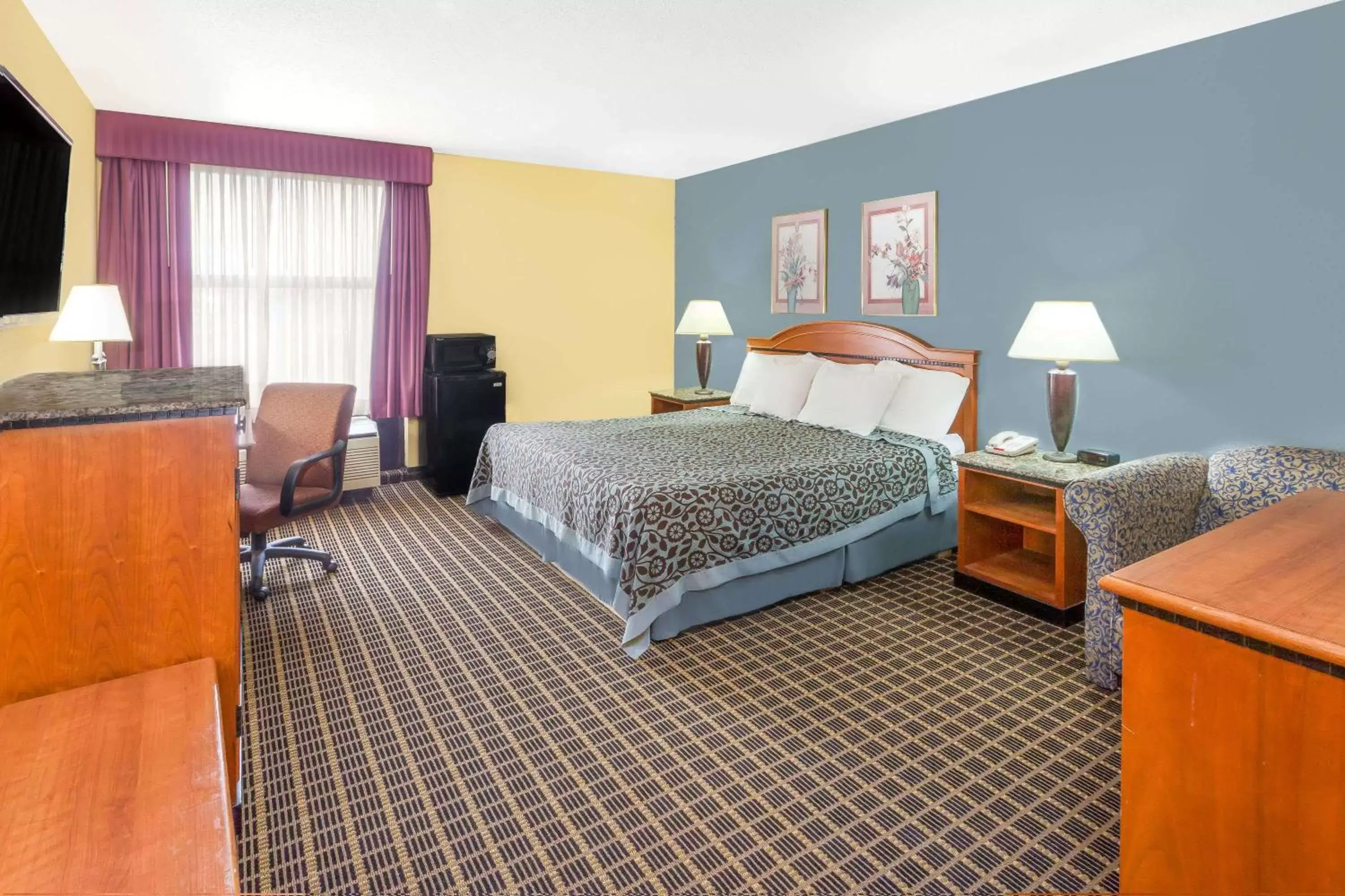 Photo of the whole room, Bed in Days Inn & Suites by Wyndham Kalamazoo