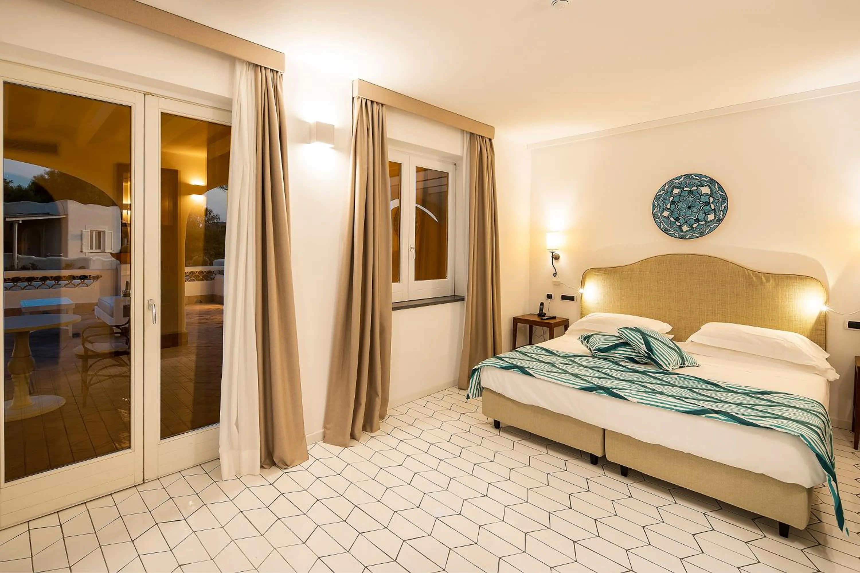 Photo of the whole room, Bed in Therasia Resort Sea and SPA - The Leading Hotels of the World