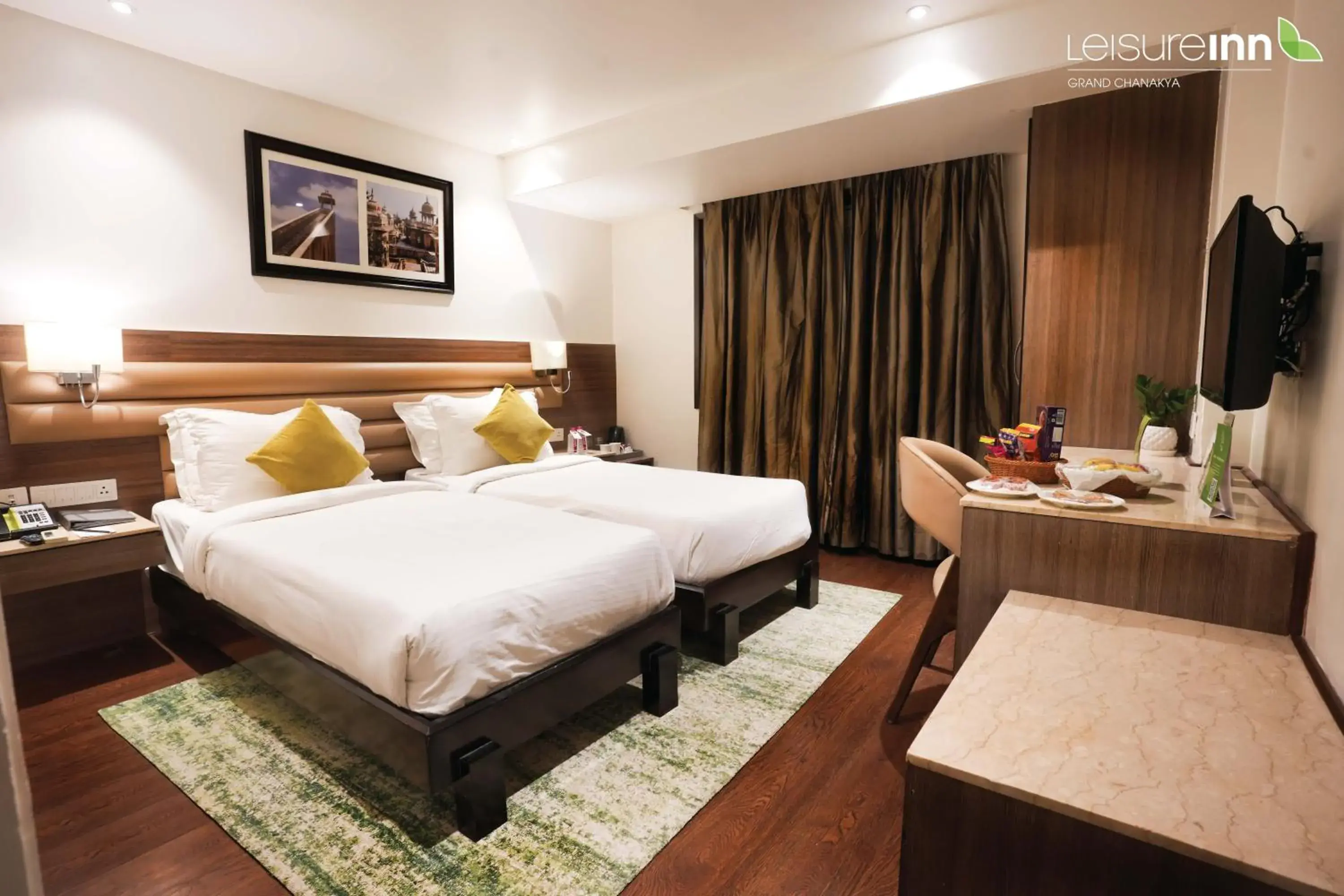 Bed in Leisure Inn Grand Chanakya