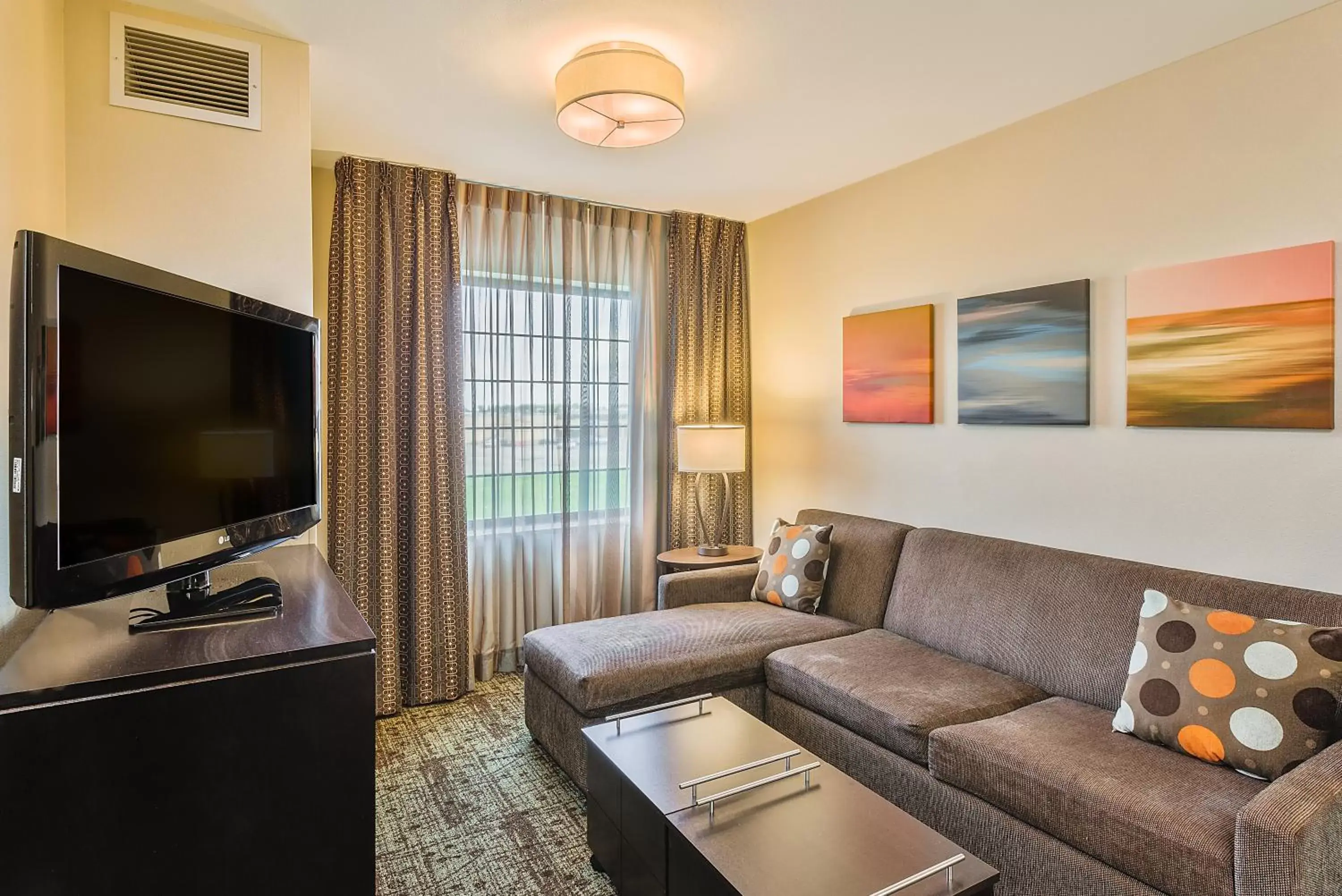 Photo of the whole room, Seating Area in Staybridge Suites Bismarck, an IHG Hotel