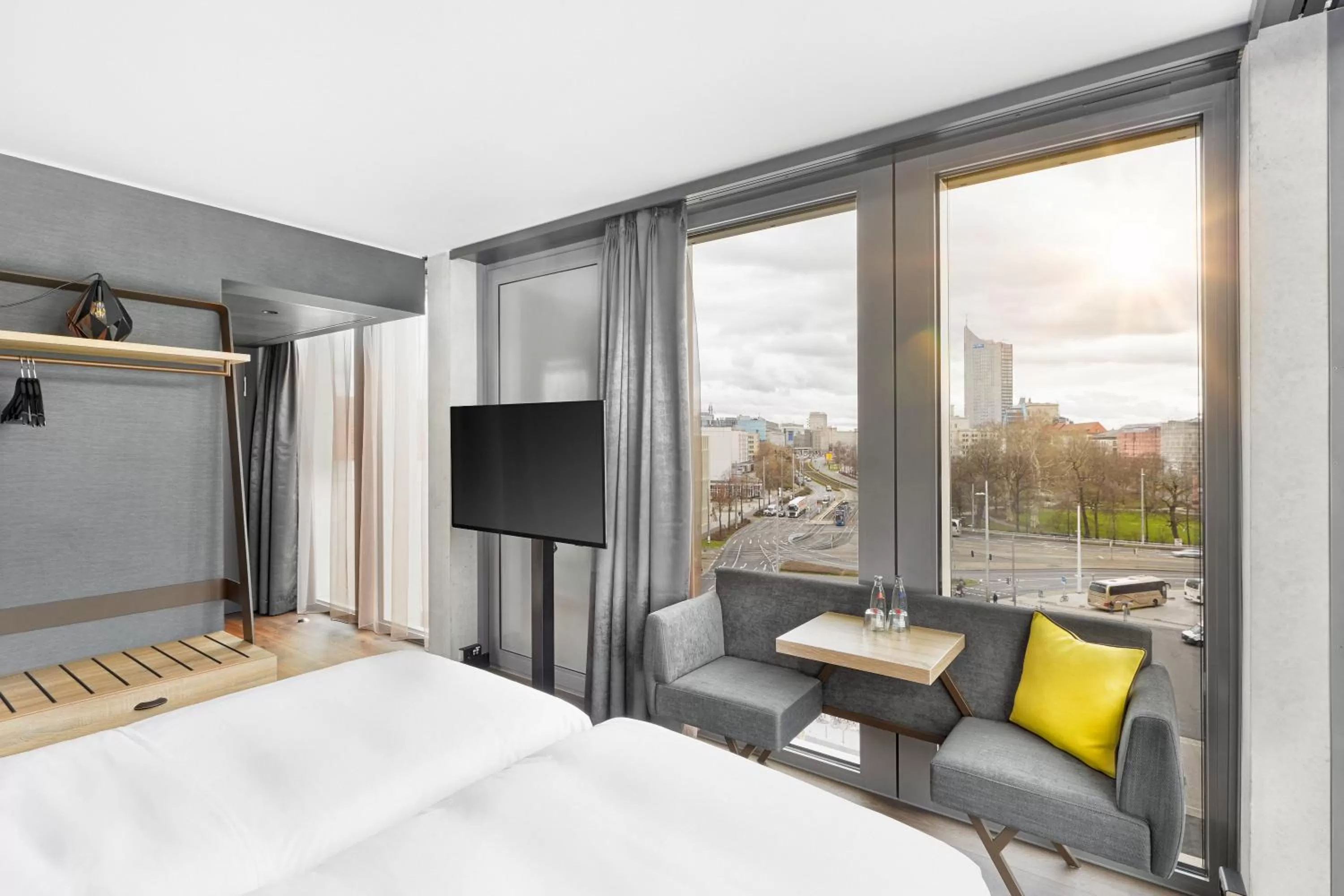 Seating area, Bed in HYPERION Hotel Leipzig