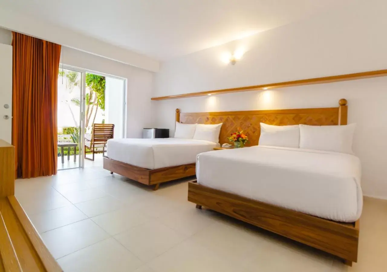 Bed in Beachscape Kin Ha Villas & Suites