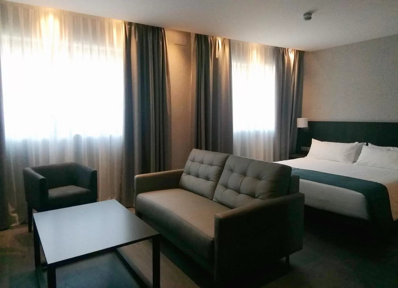 Photo of the whole room, Bed in HG City Suites Barcelona