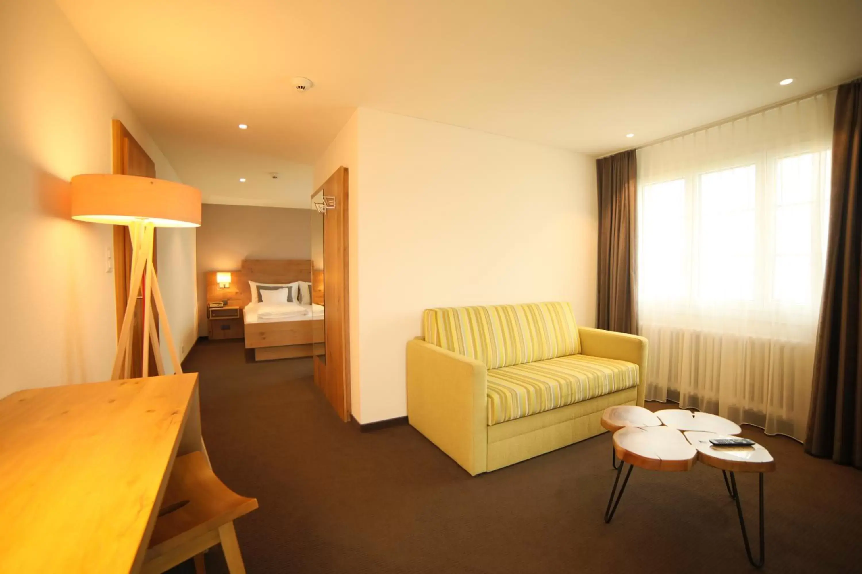 Bed, Seating Area in Hotel Friedheim