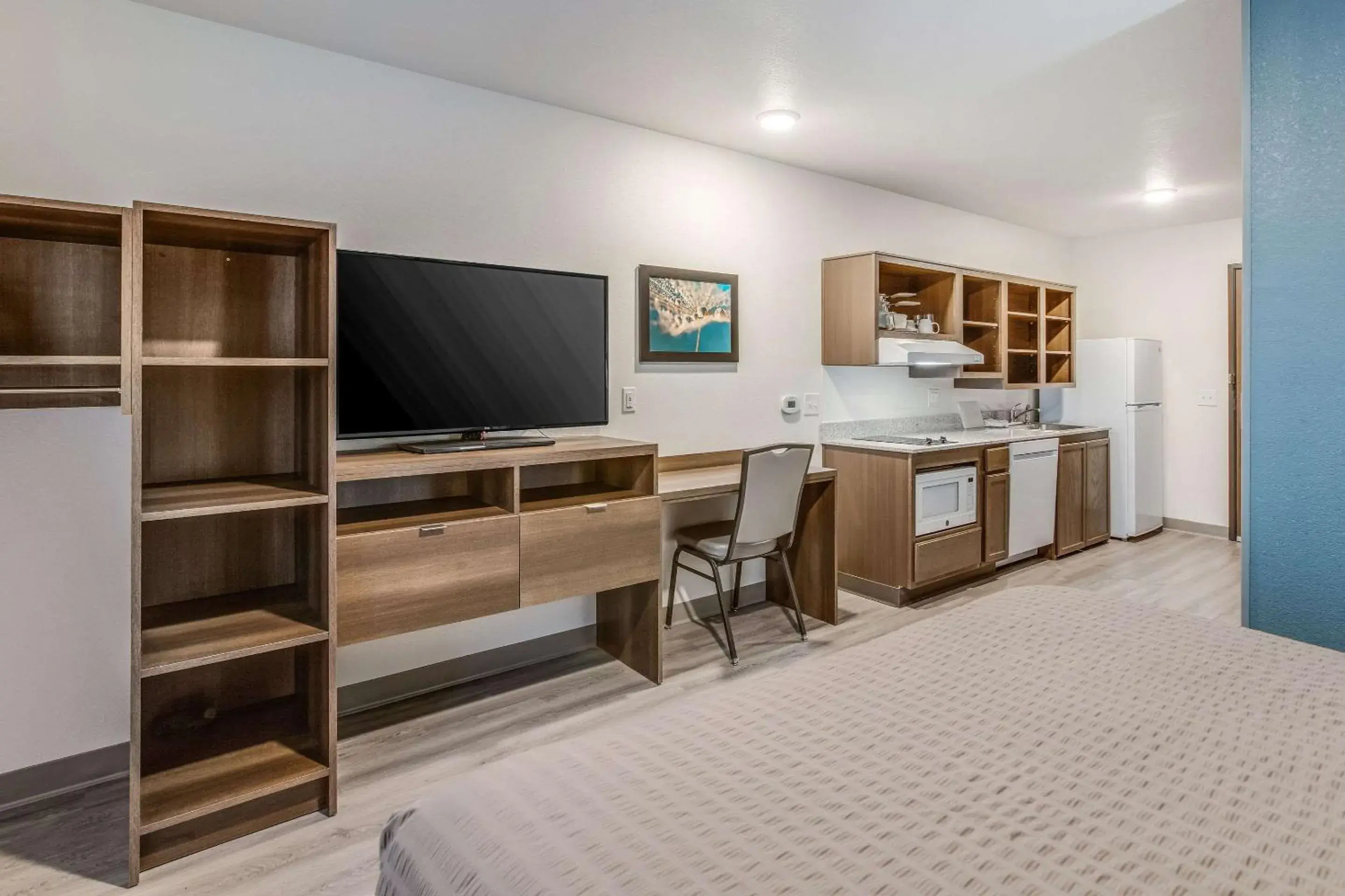 Photo of the whole room, TV/Entertainment Center in WoodSpring Suites Detroit Farmington Hills