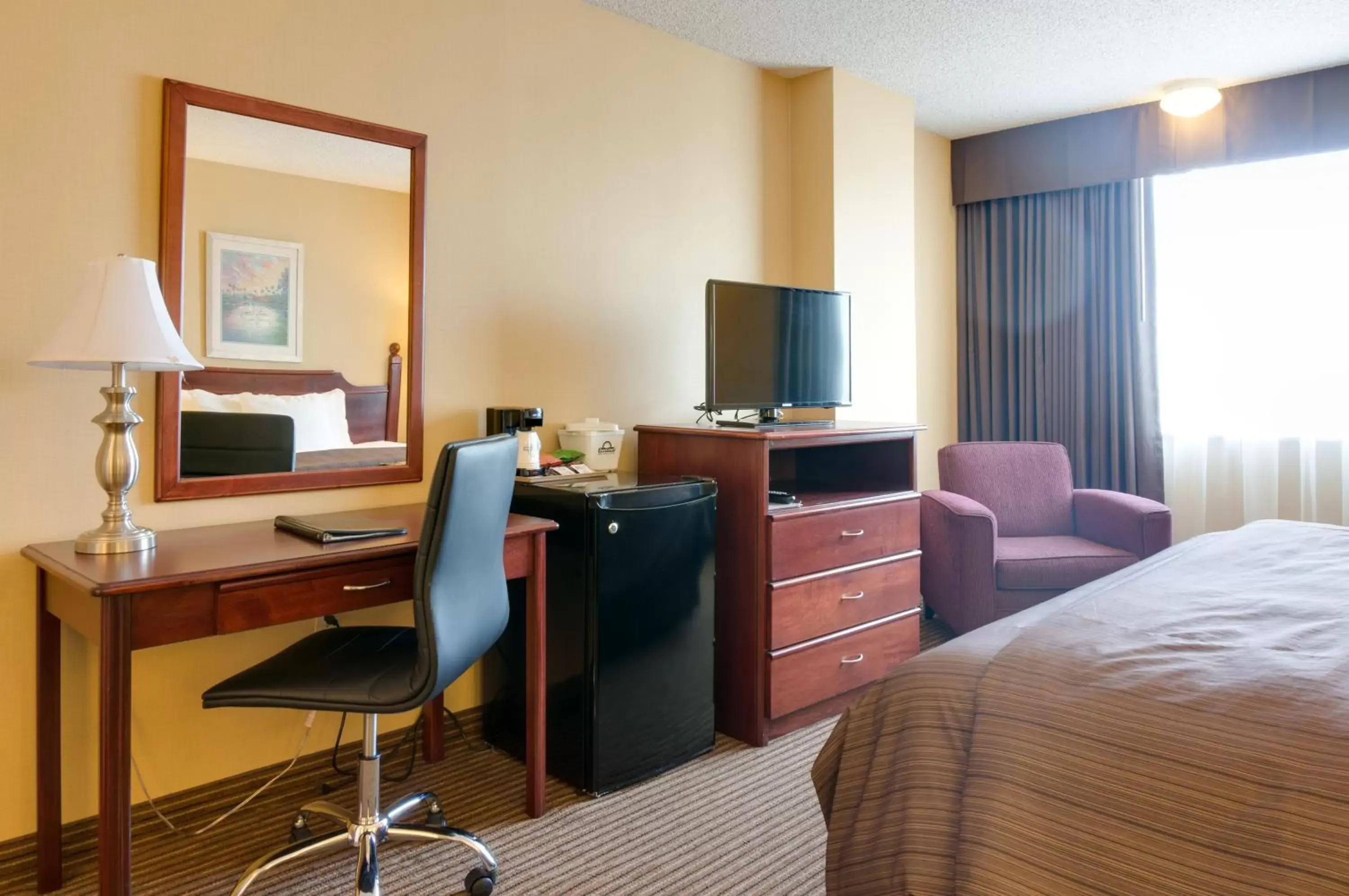 Photo of the whole room, TV/Entertainment Center in Days Inn by Wyndham Calgary South