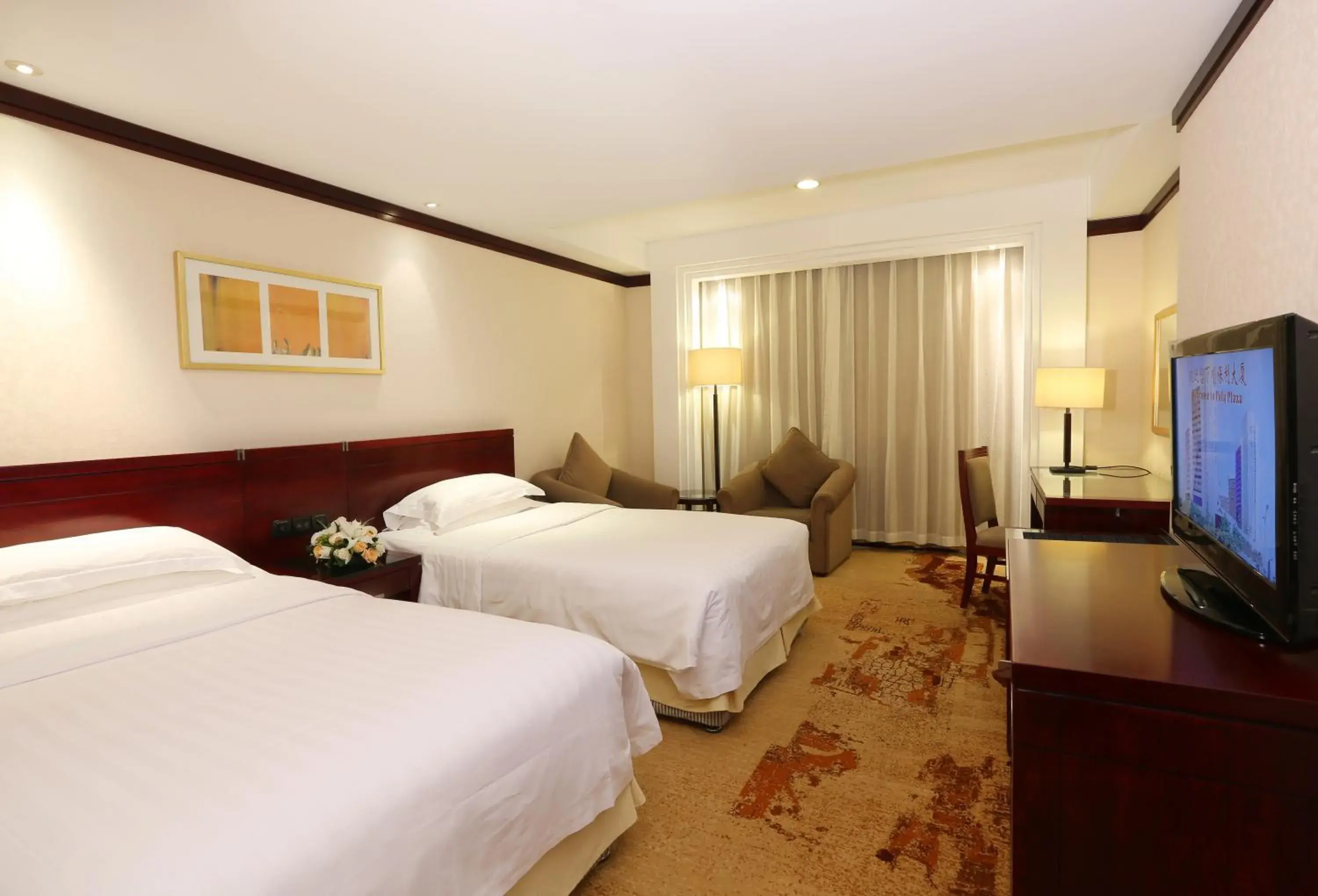 Bed in Poly Plaza Hotel